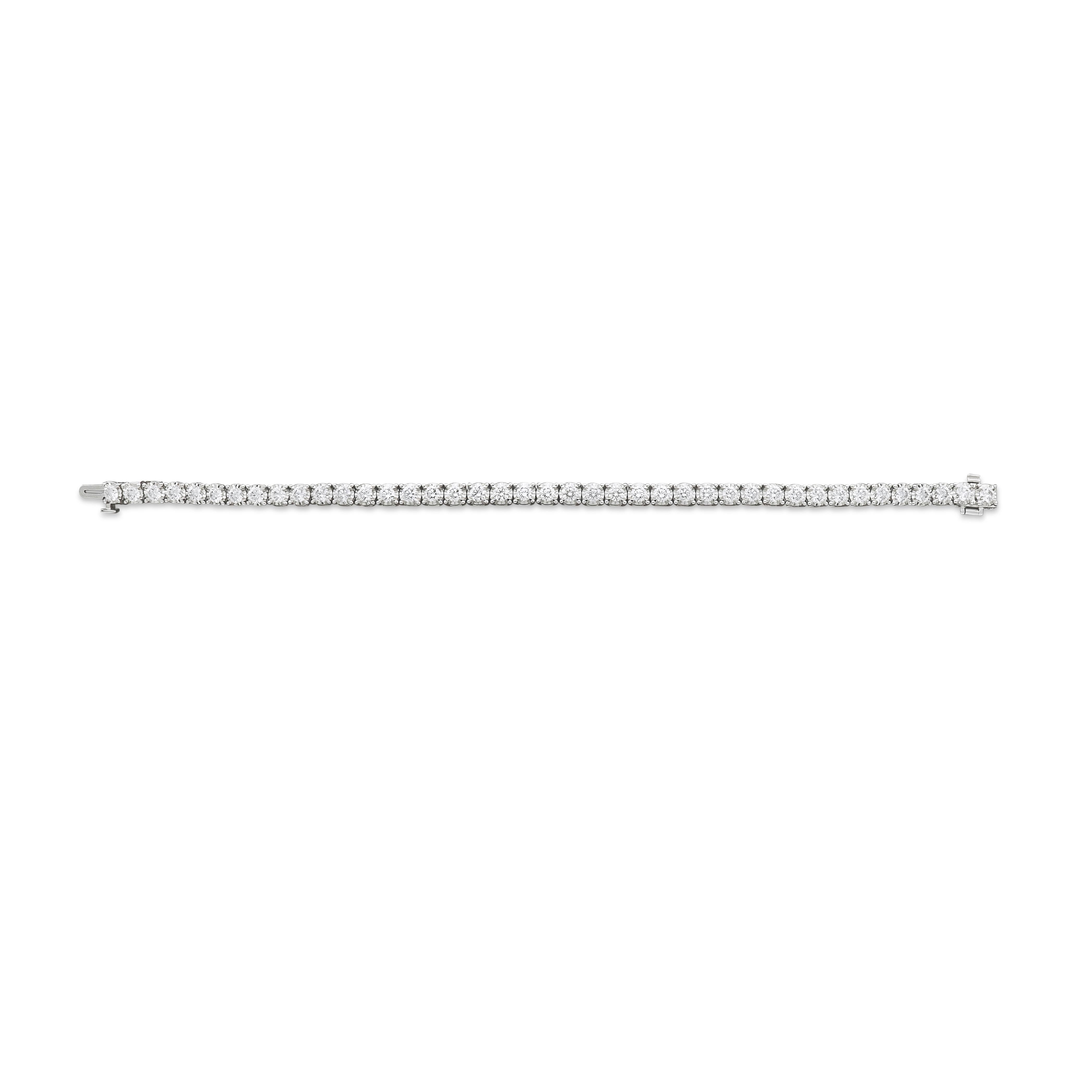 An elegant 18 karat gold tennis bracelet featuring a stream of brilliance that embraces the wrist. This round cut diamond bracelet, set in white gold celebrates the purity of the finest diamonds showcased in truly enduring jewels. 
18 Karat White