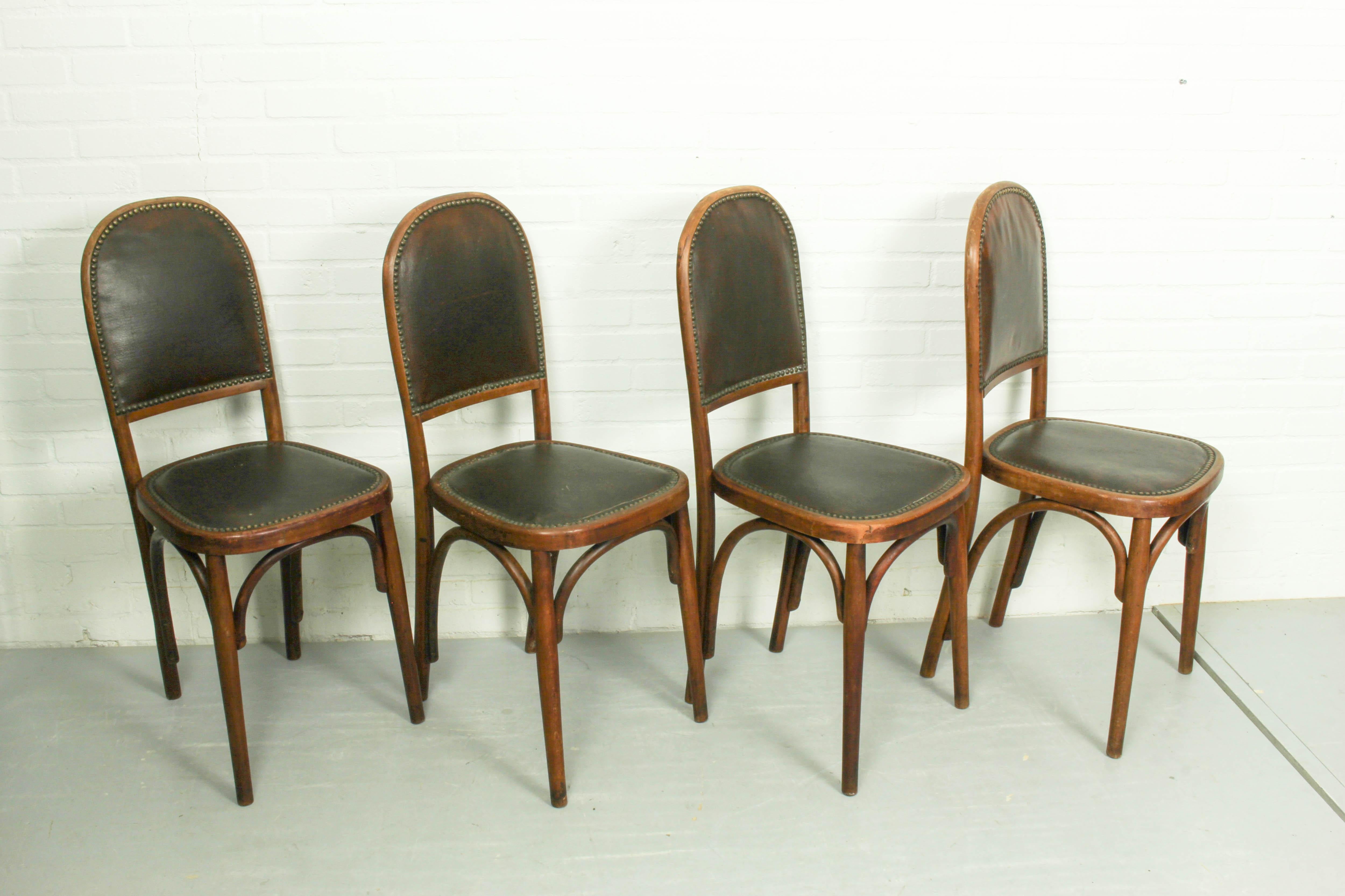 Superb and very rare dining room set of 4 chairs. Made by Fischel, circa 1905-1910.Fischel is with Thonet, Kohn and Mundus one of the leading manufacturers of bentwood furniture. In good vintage condition, everything is stabile.The leather seems to
