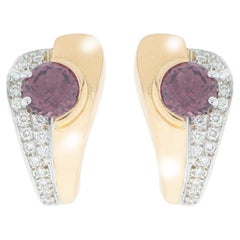 " Carmine" Earrings in White 
Rose Gold with H SI 1 Brilliants and Rhodolite.