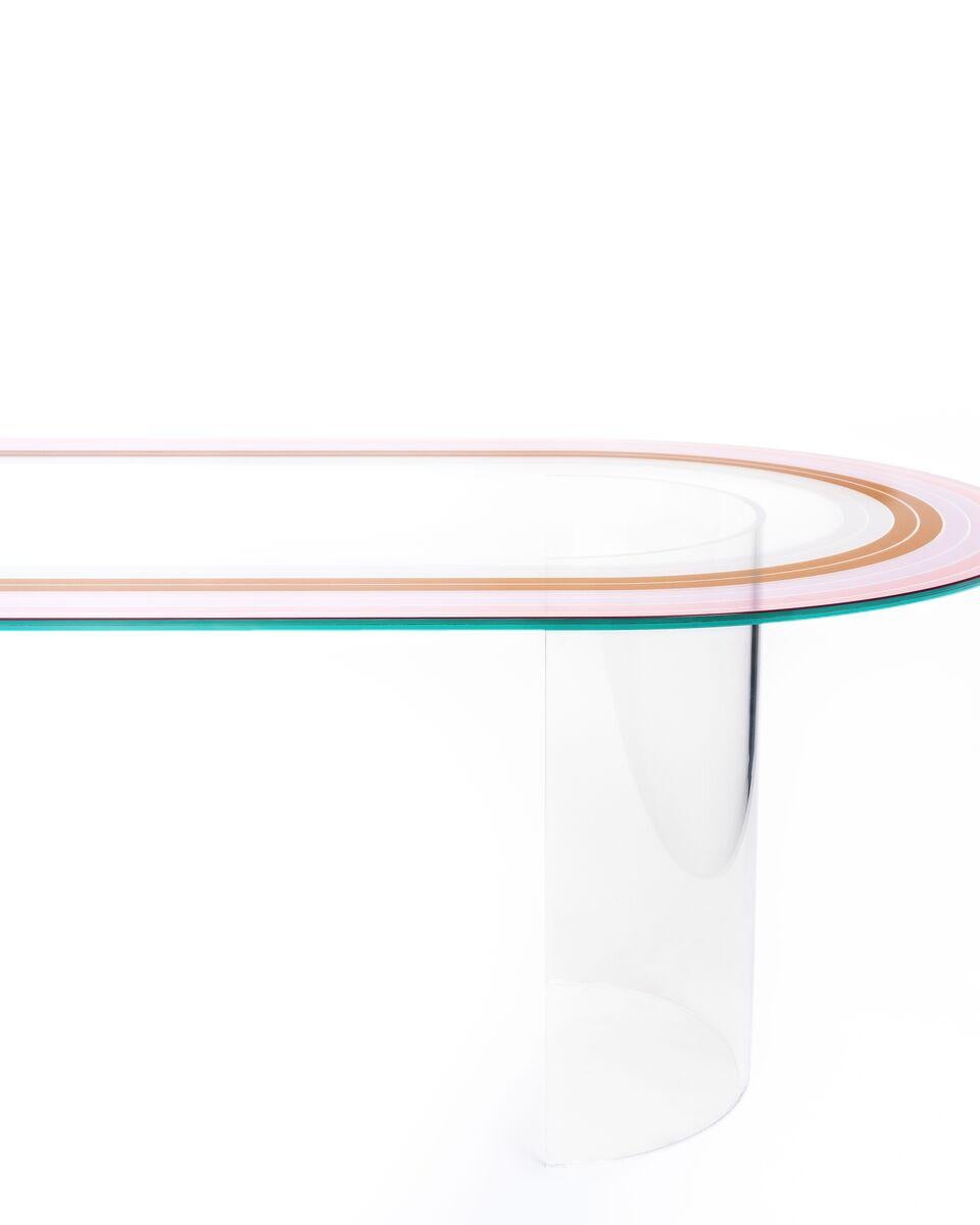 As part of the Court series, the track table debuted at the International Contemporary Furniture Fair in 2018.

 Printed 1/2” interlayer glass surface
 Acrylic semi-circle bases in clear
 Made in USA