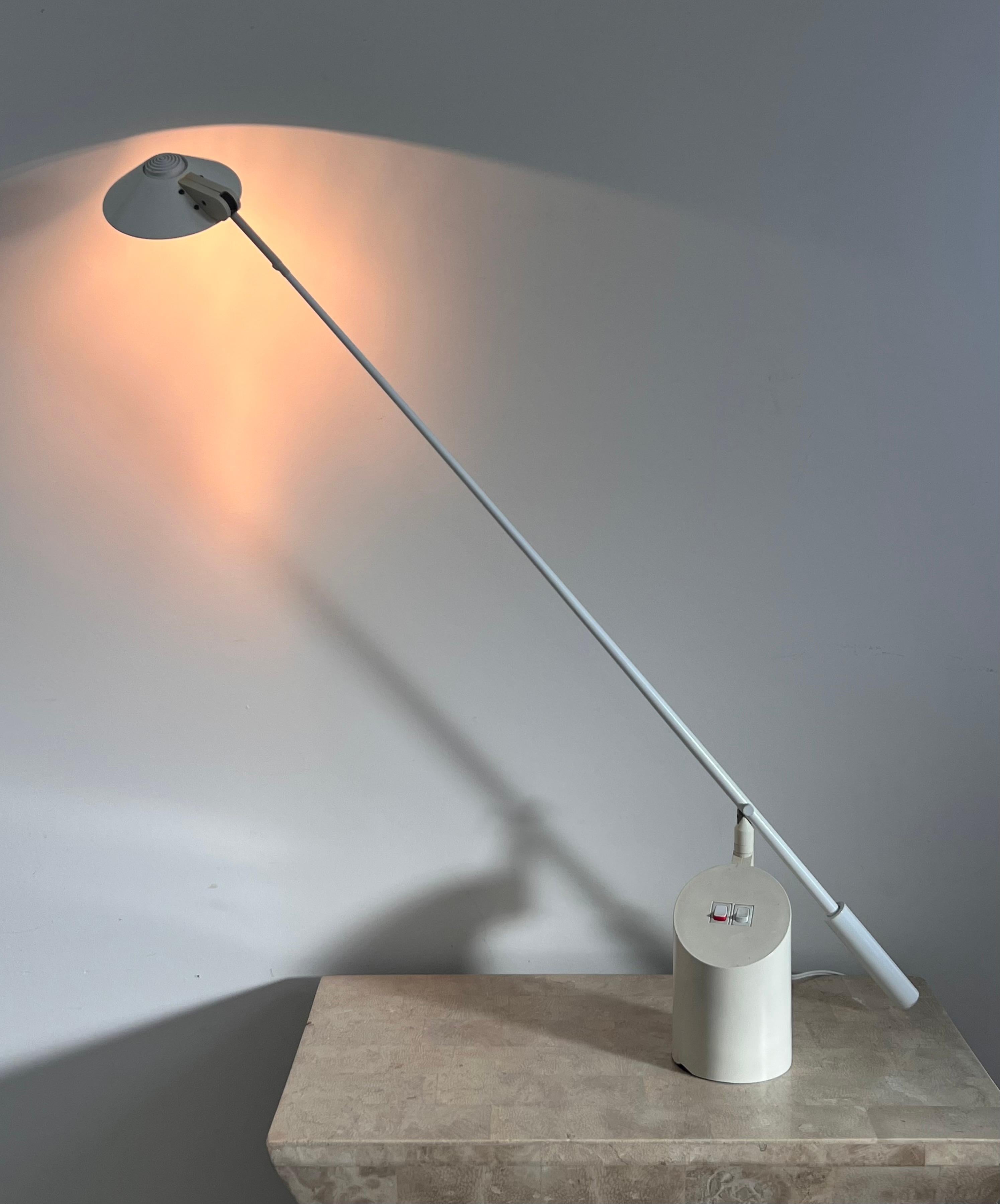 A “Feather” task lamp by Robert Sonneman for George Kovacs, 1989. Equipped with a double switch for on/off and high/low light. Original wiring; uses a 2 pin halogen bulb. Crane neck floats gracefully up and down and can circulate 360 degrees. This