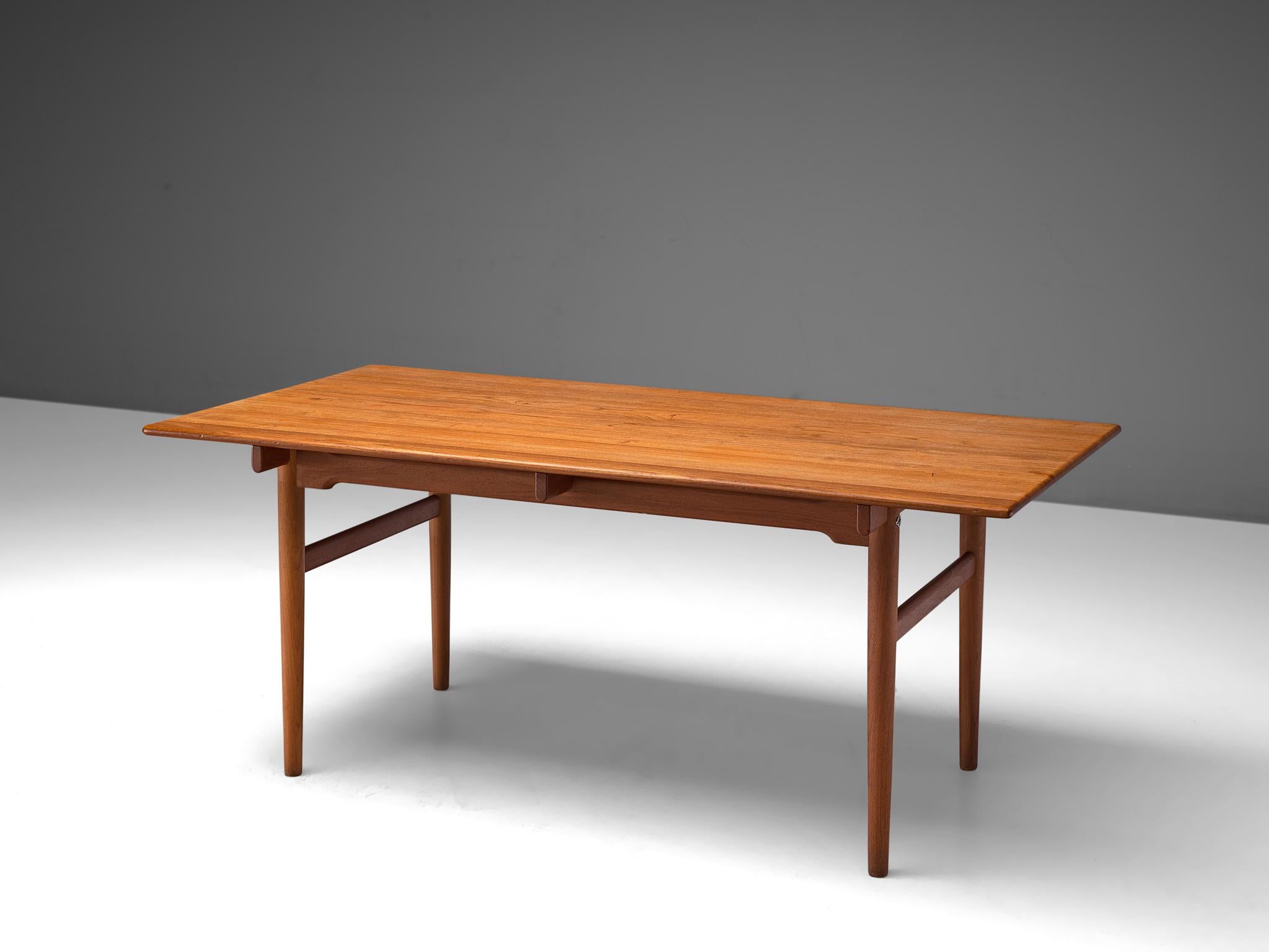 Hans J. Wegner for Andreas Tuck, dining table, teak, Denmark, 1955.

Dining table with straight tapered legs, by the Danish Designer Hans Wegner. This table is considered as an iconic architectural design by Wegner as he experimented in this model