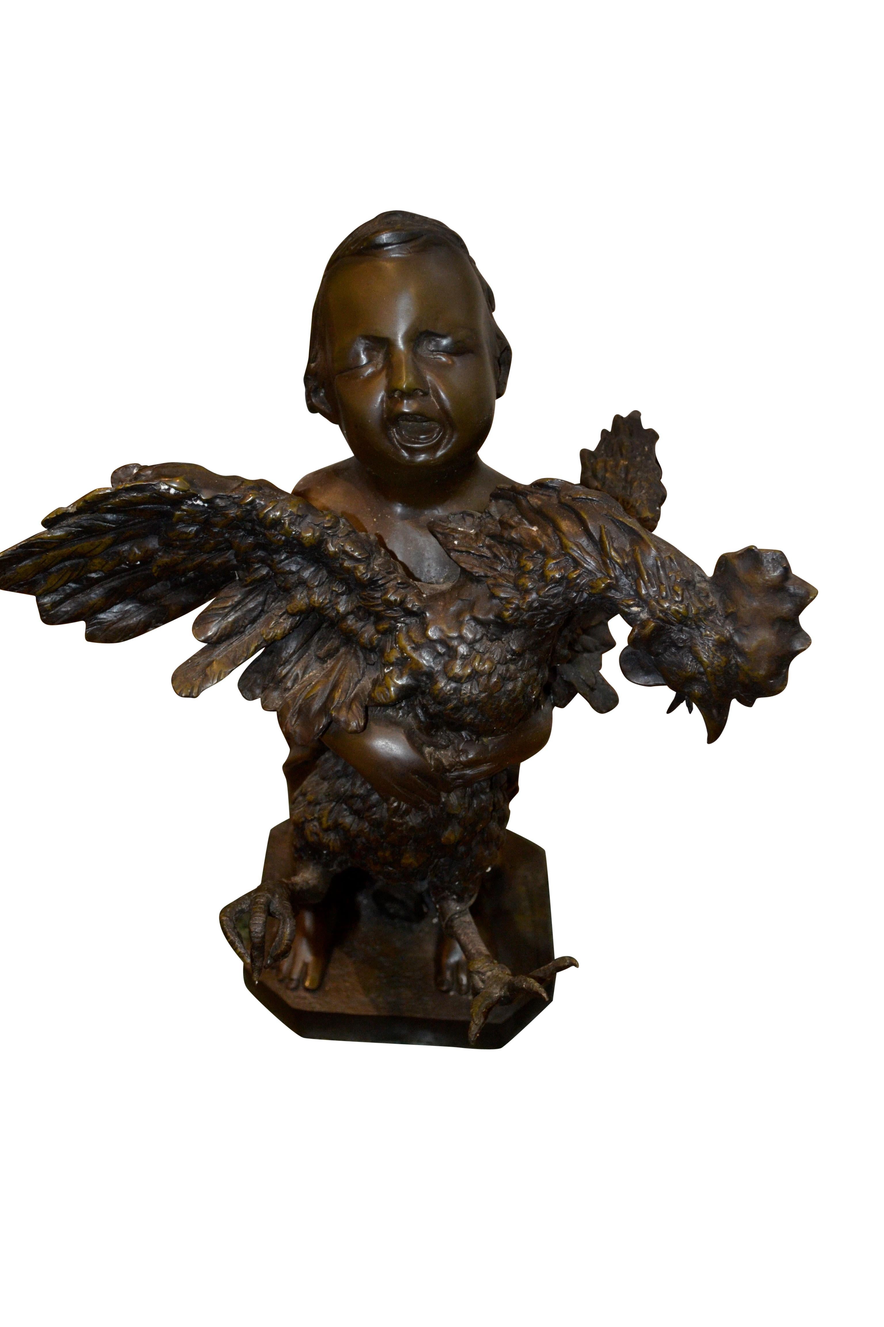 A bronze statue of a young boy standing and holding a tethered rooster with wildly flapping wings in his arms. The boy is presumably in a farmers' market and his expression shows him screaming at the top of his lungs trying to sell the rooster. The