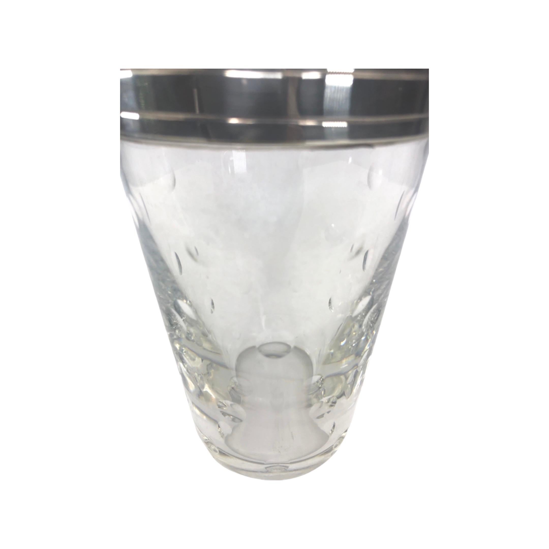 1930s French St. Louis Crystal Cocktail Shaker. The heavy leaded crystal shaker features dimpled design in the crystal and a silver plated collar and lid. Stamped on the underside 