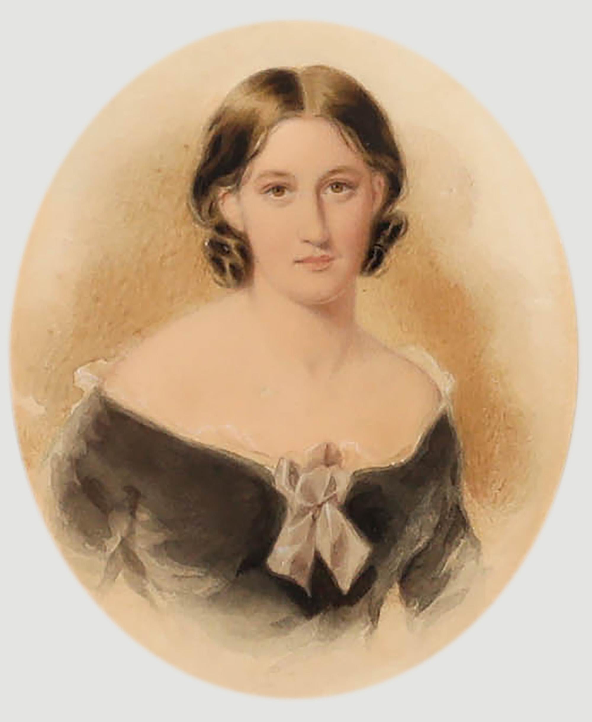 A beautifully painted watercolour portrait of a pretty young woman. Her hazel brown eyes are wonderfully captured, full of light and youth. The miniature portrait is well presented in an oval mount and Hogarth style frame. Framers label to the