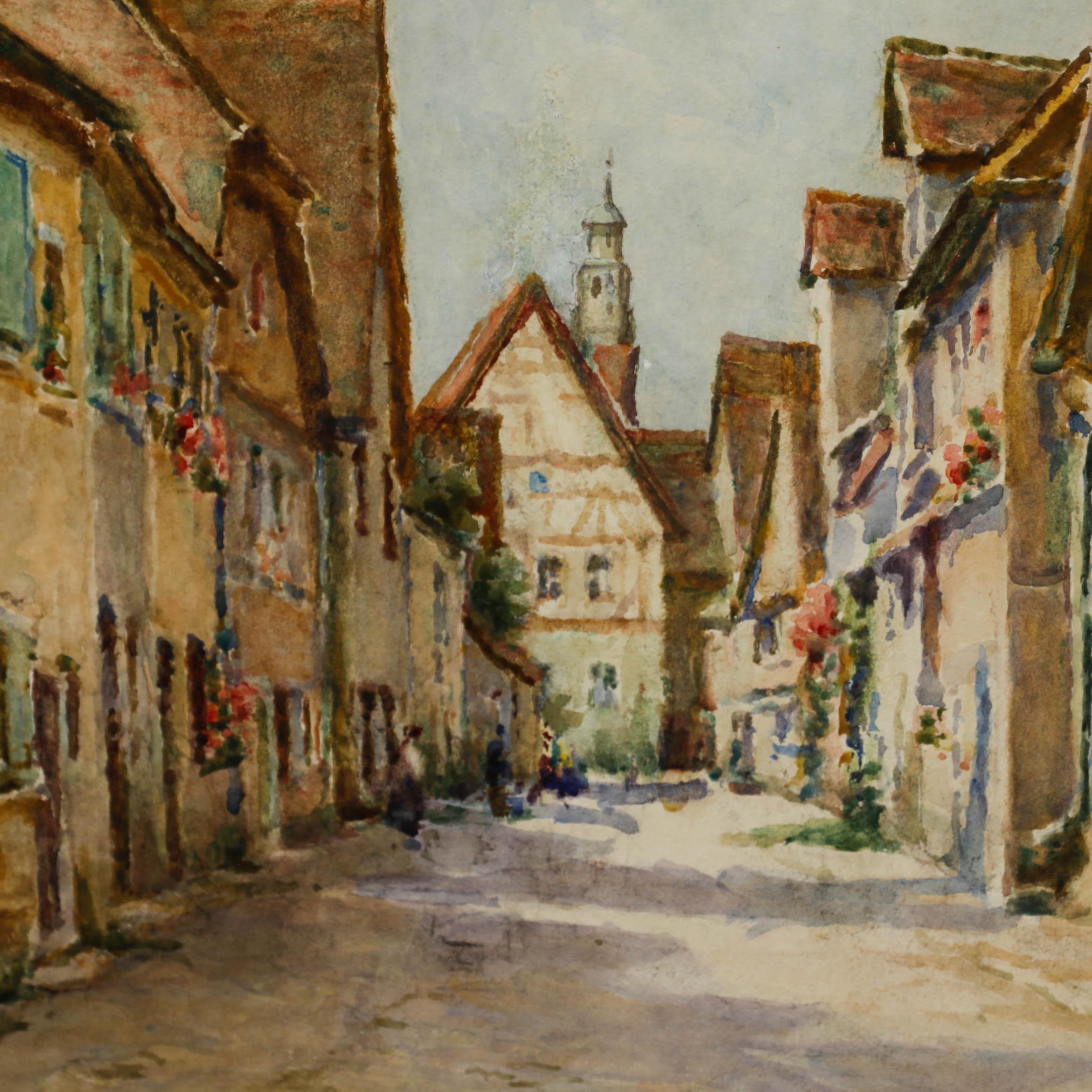Eine gelungene Aquarellmalerei des britischen Künstlers Tom Clough. Die Szene zeigt eine charmante Dorfstraße mit Fachwerkhäusern und Figuren in der Ferne. Unterschrieben. Präsentiert in einem vergoldeten Rahmen und doppeltem Passepartout. Auf dem