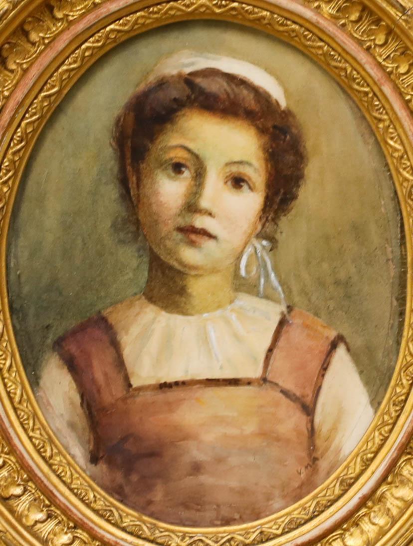 English School, late 19th-century portrait of a young woman. Signed 'V.M.A' lower right. Well presented in a beautiful oval gilded frame with elaborate running patterns. On paper. 