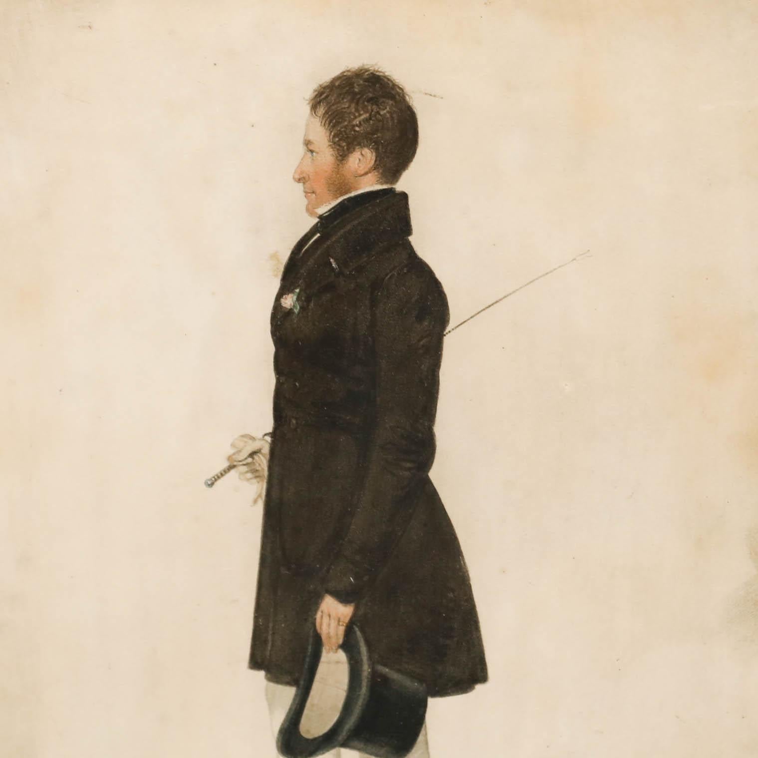 This elegant portrait captures a gentleman in profile, dressed in the refined style of the early 19th century. The man rests a fencing foil in his right arm and holds a top hat in his left. Signed in graphite. Presented in a black frame with red