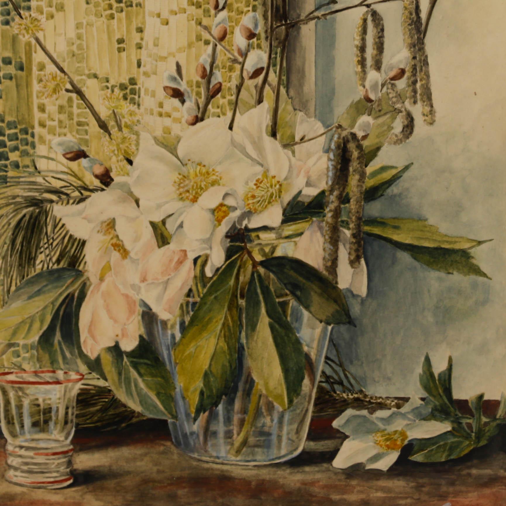This delicate watercolour painting depicts a beautiful still life of white magnolia and catkins flowers, arranged in a short translucent vase. The composition has been signed by the artist to the lower right and dated 1946. Well presented in a