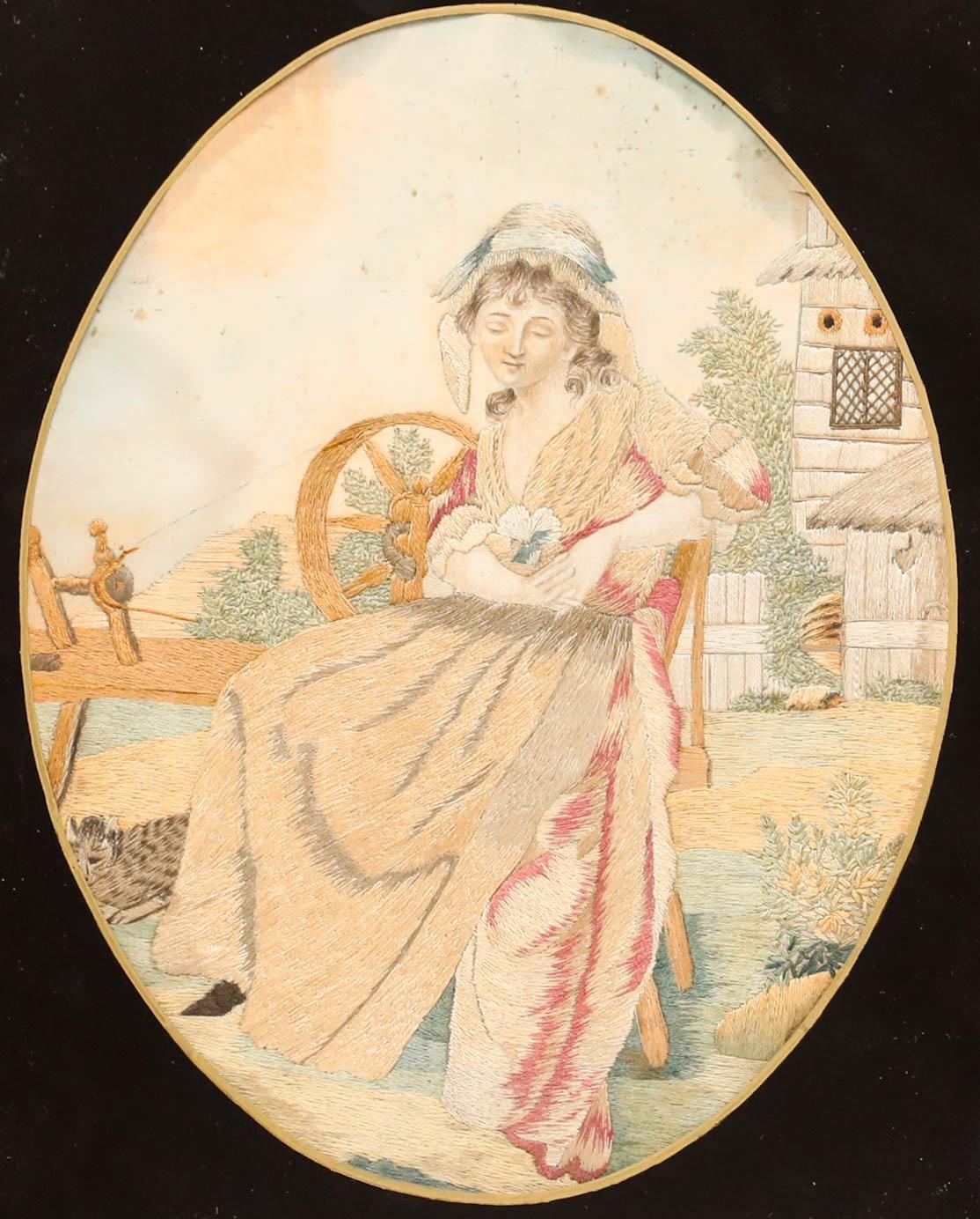 This detailed embroidery depicts a woman seated by a spinning wheel. Presented in a gilt frame with decorative foliate corners and a verre églomisé mount. Acquired with a companion work, also listed on our website. On silk. 