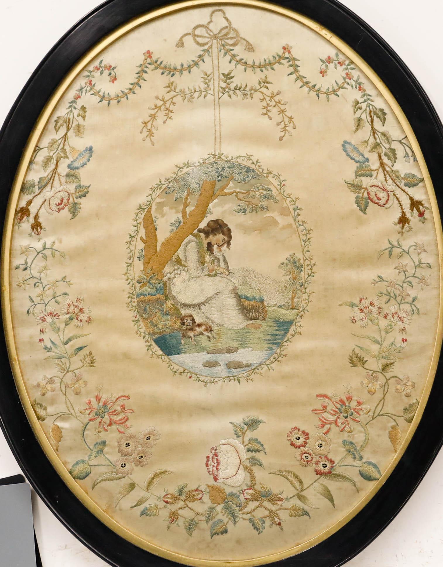 A charming Georgian silk embroidery panel depicting a young lady and her faithful dog resting by the river. Executed with remarkable skill, the artist has rendered this idyllic scene with meticulous attention to detail, blending fine needlework with