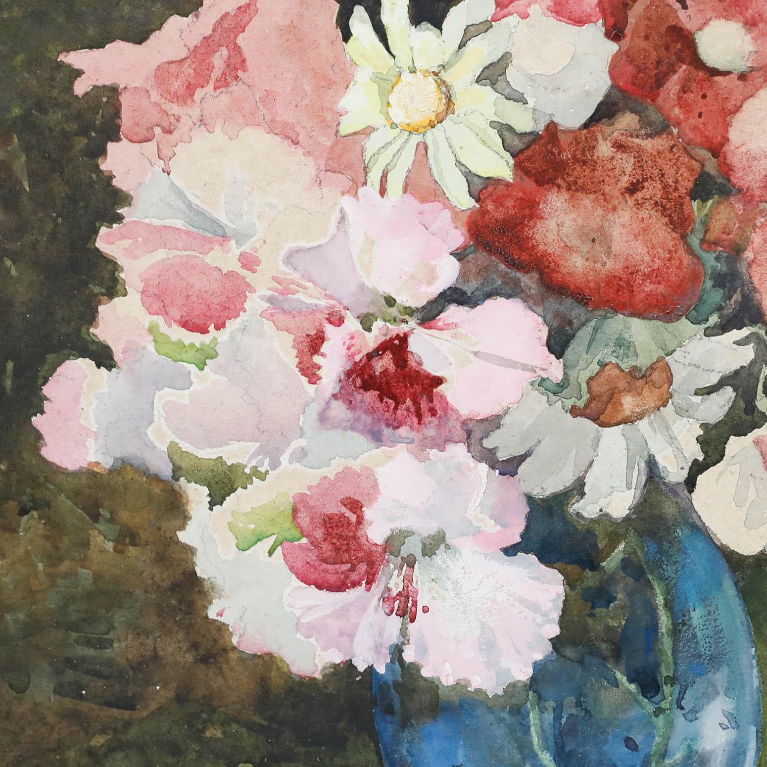 A beautiful early 20th century watercolour still life depicting a delightful arrangement of pink and white flowers in a glass vase. The work is unsigned and well-presented in a glazed wooden frame. Acquired with a companion piece also available on