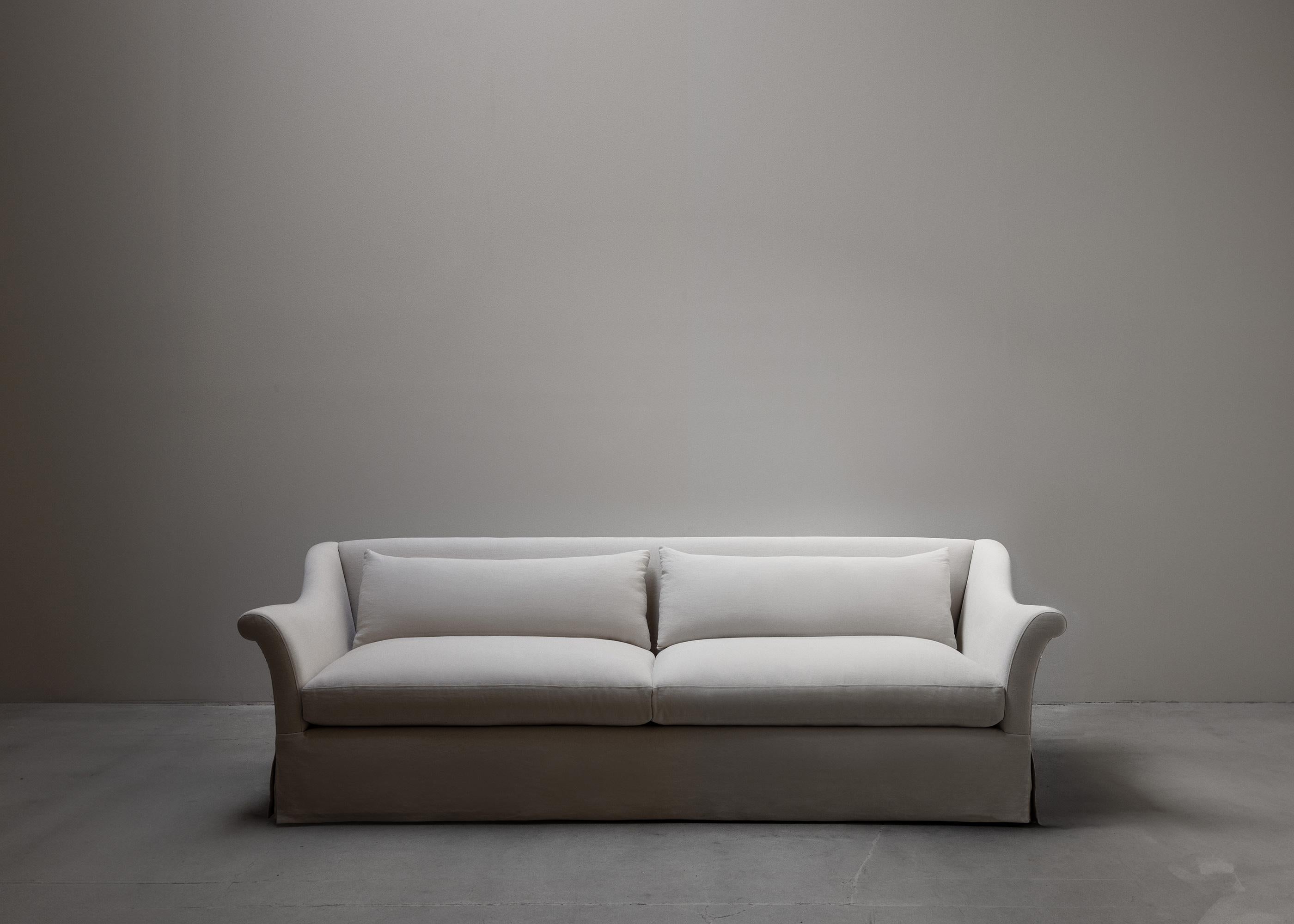 TIMELESS STRUCTURE MADE FOR COMFORT

Made-to-order by masters of their craft, the Classic Sofa is fully upholstered, featuring sloped scrolled arms, and two loose seat and back cushions. It is Galerie Solis’s most traditional offering, lending