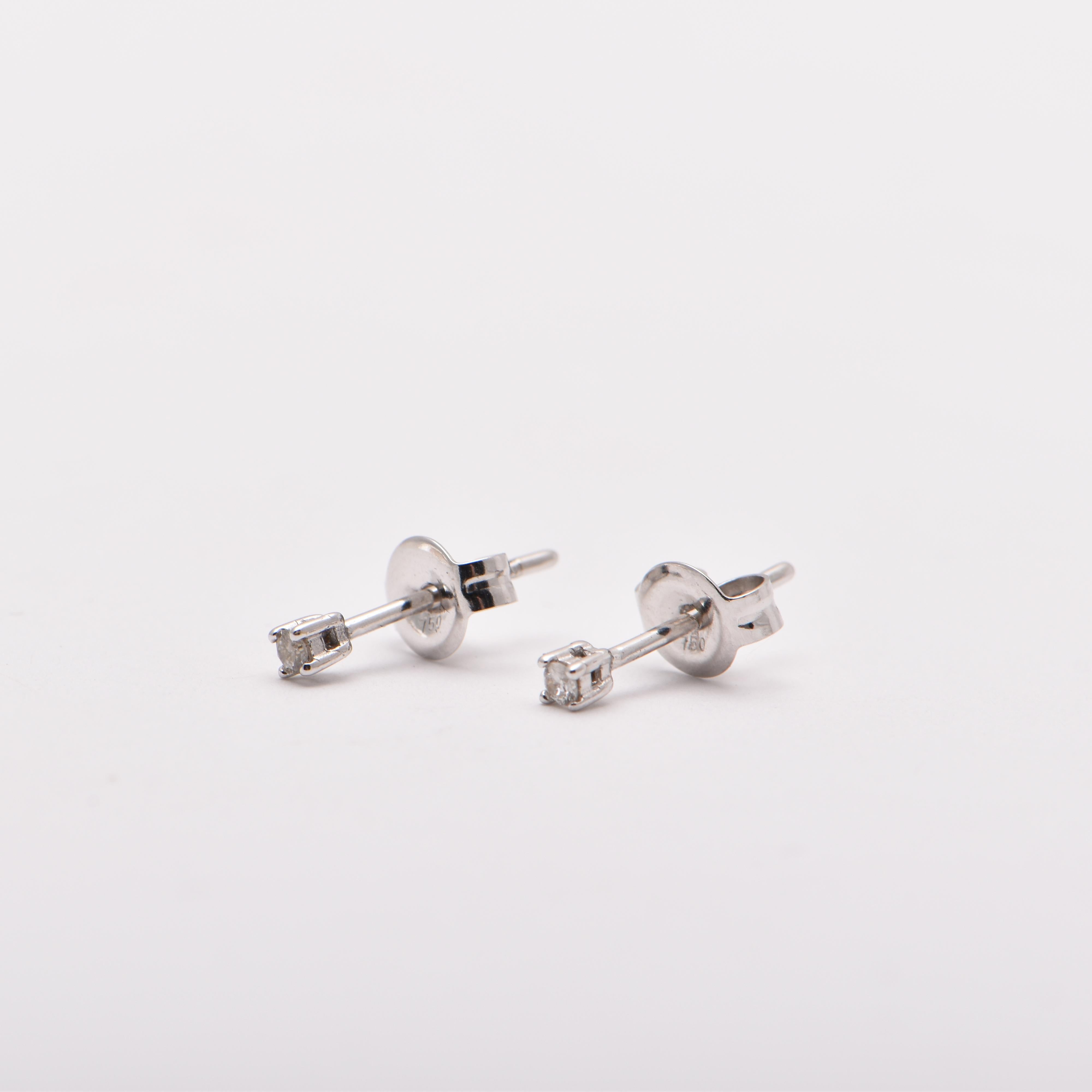 0.03 Carat Diamond Studs in 18 Carat White Gold by Cartmer Jewellery   

2 Diamonds totalling 0.03 carats   

FREE express postage usually 3-4 days Sydney to New York  
FREE international insurance  
by Cartmer Jewellery, The Dymocks Building, Sydney