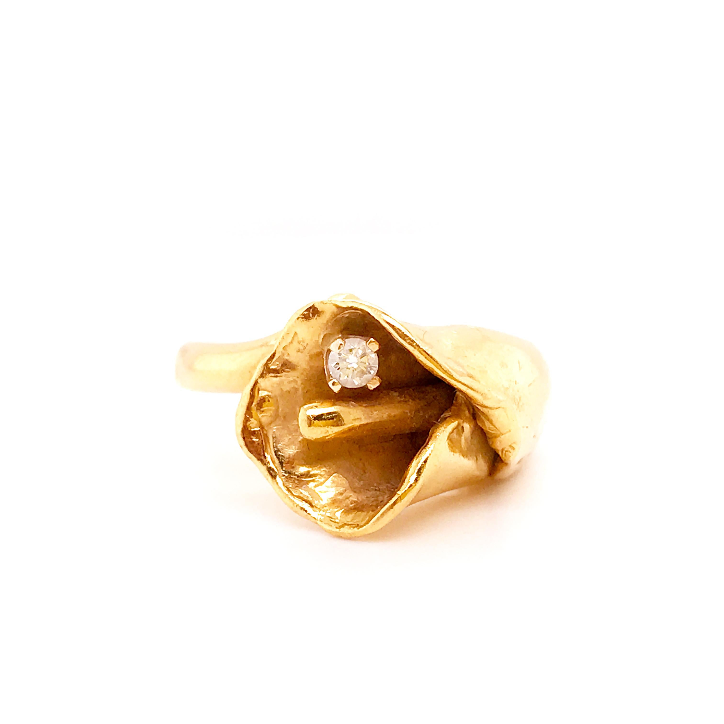 For the flower lover, florist, nature admirer this ring from Circa 1950 is perfect! This handmade tulip ring has a round brilliant diamond set in the center of the gorgeous blooming tulip flower. The ring is a tulip wrapped around itself to create a