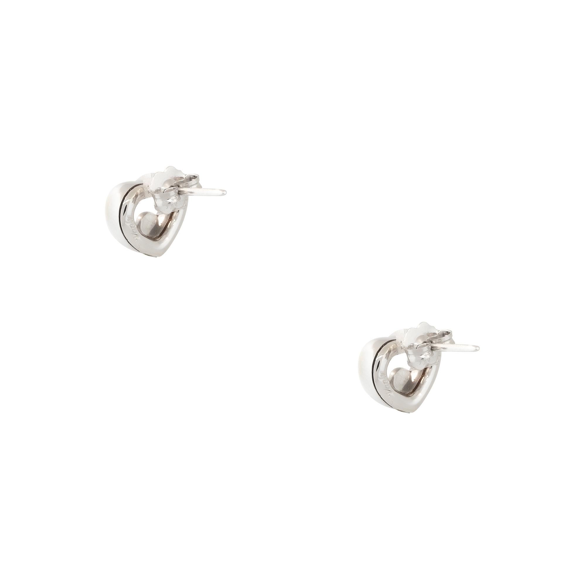18k White Gold 0.05ctw Floating Diamond Heart Shaped Earrings

Material: 18k White Gold
Diamond Details: Approximately 0.05ctw of Round Cut Diamonds
Total Weight: 5.44g (3.5dwt) 
Earring Backs: Friction Backs
Additional Details: This item comes with