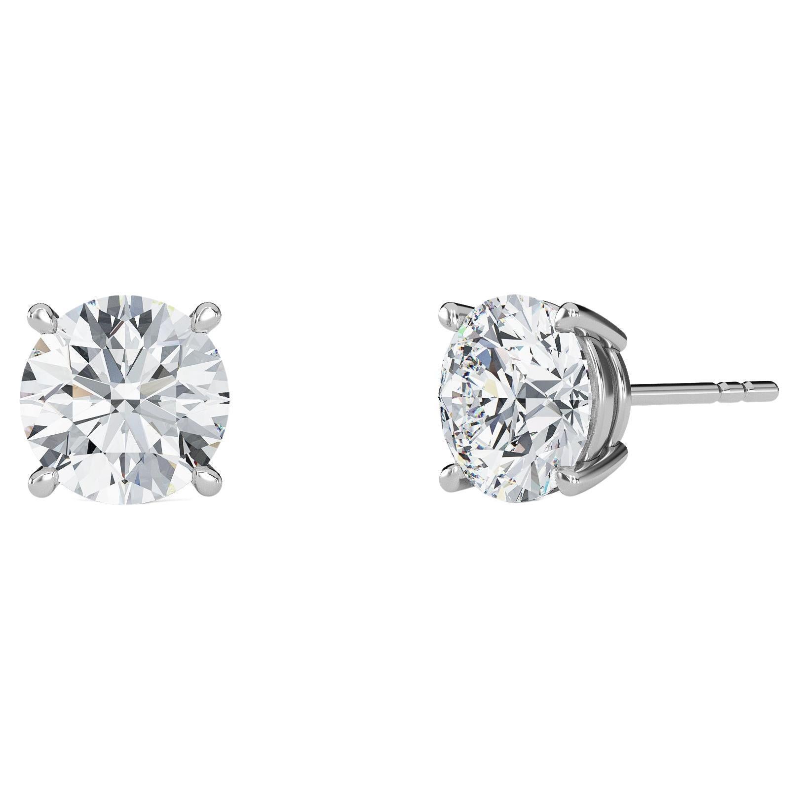 0.05 Carat TW Natural Diamond 14k Gold Four Prong Stud Earring For Sale