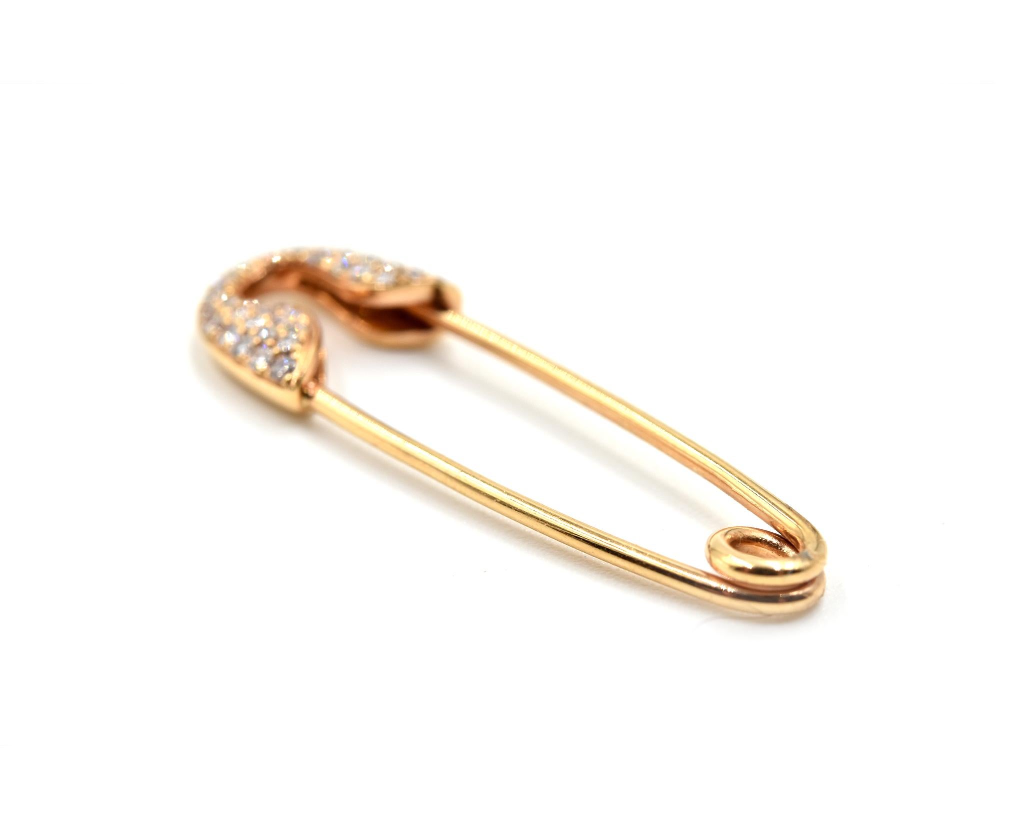 Designer: custom design
Material: 18k rose gold
Diamonds: 36 round brilliant cuts = 0.08 carat total weight
Color: H
Clarity: VS2
Dimensions: pendant measures 1 1/4-inch long x 3/8-inch wide
Weight: 1.6 grams
