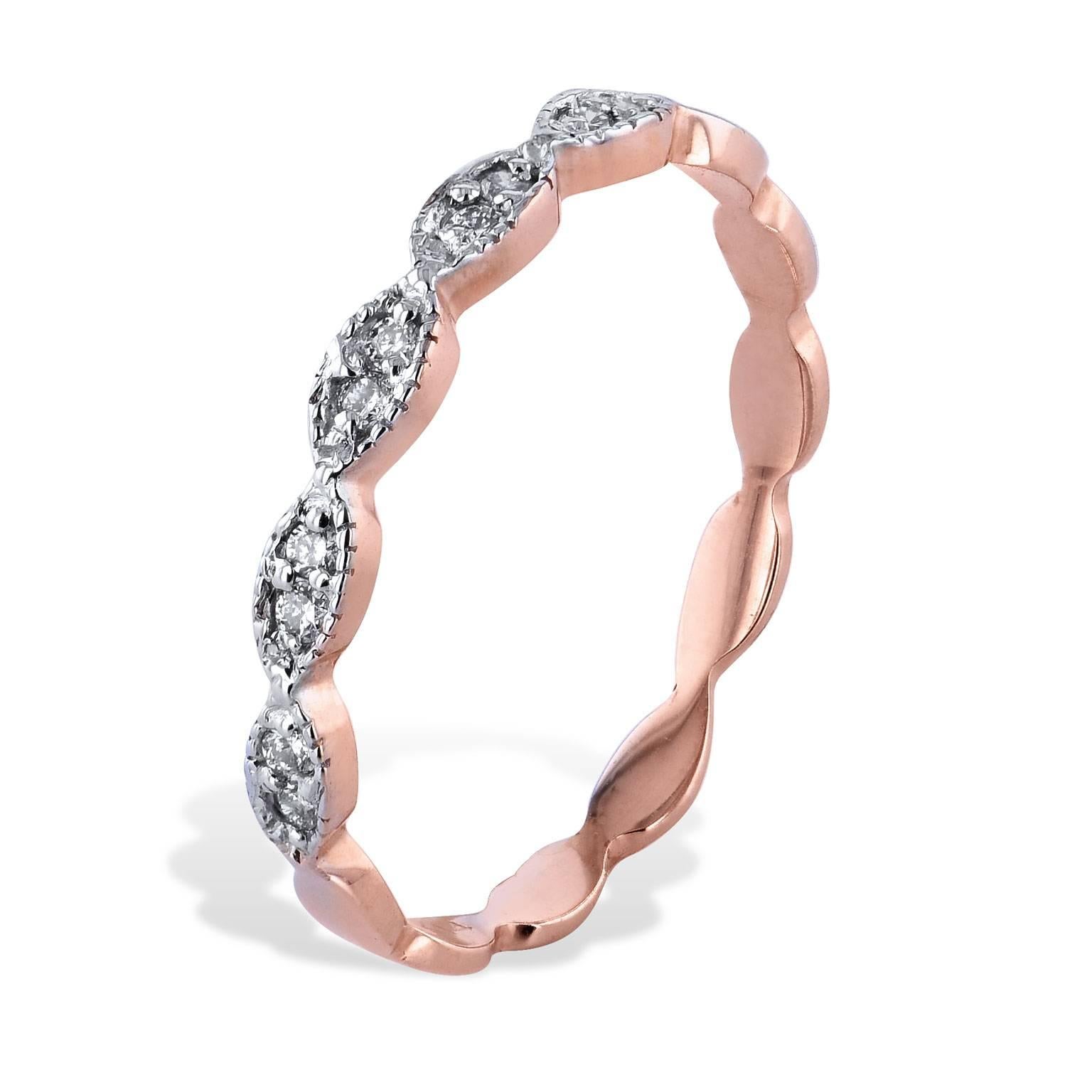 Interlocking ovals featuring 0.08 carat of diamond evoke a sense of movement in this 14 karat rose gold diamond band (size 6.5).