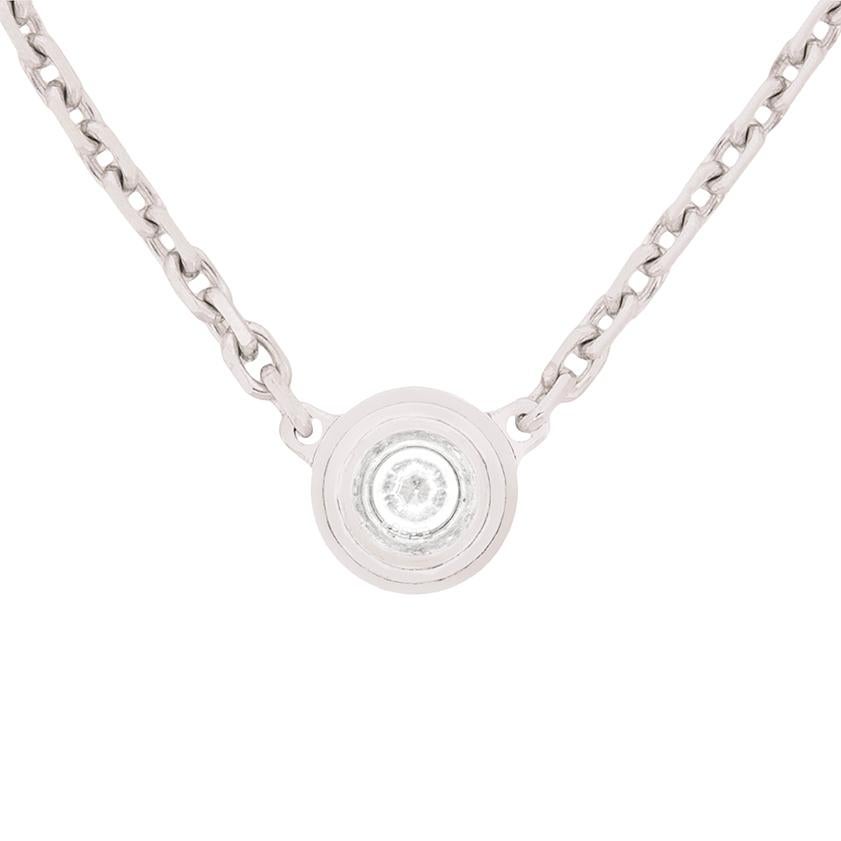 This delicate necklace from Cartier features a 0.09 carat diamond within a rub over setting. The sparkling stone is F in colour and VS in clarity and is a round brilliant. The setting work is made in 18 carat white gold and attaches to the chain at