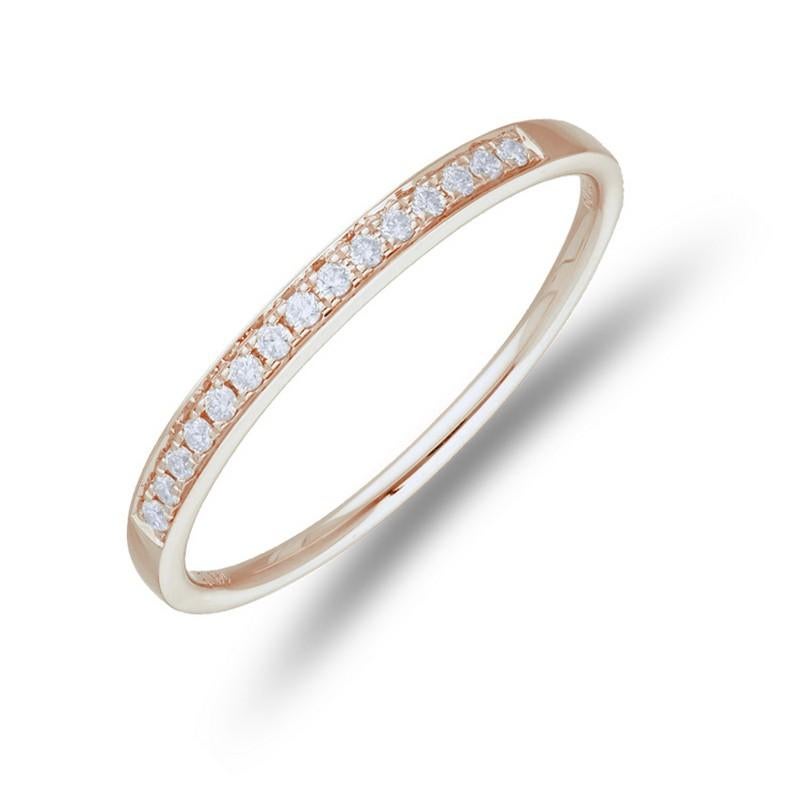 Diamond Total Carat Weight: This elegant 1981 Classic Collection wedding ring features a total carat weight of 0.09 carats, showcasing 15 petite round diamonds that add a touch of sparkle and sophistication.

Gold Setting: Crafted with precision in