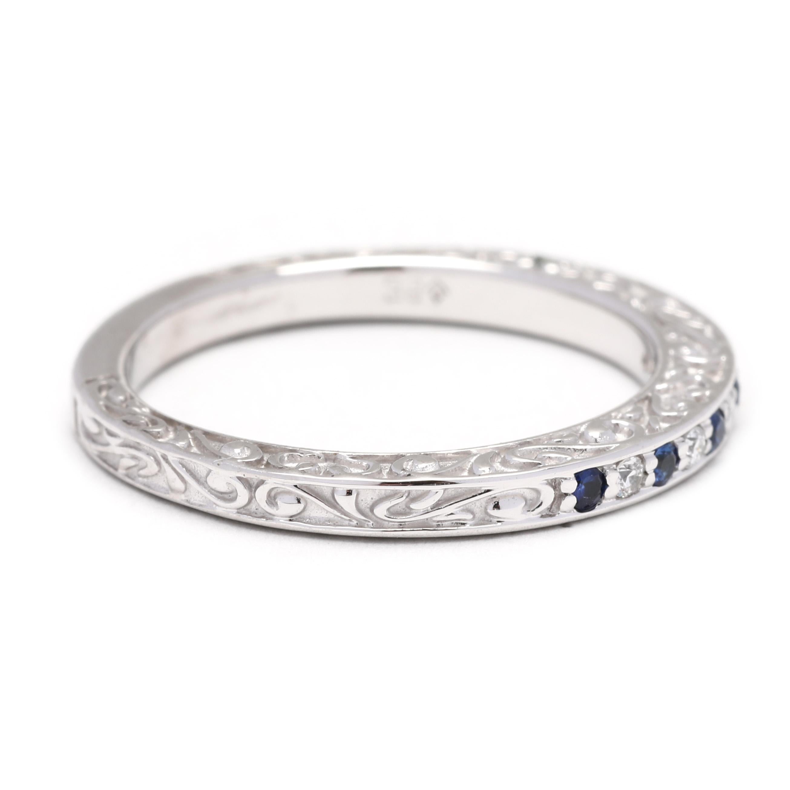 This elegant 0.09ctw sapphire and diamond wedding band in 18K white gold is ideal for making an intimate statement. With a delicate thin band and intricate diamond and sapphire engravings, this gorgeous ring is the perfect way to commemorate your