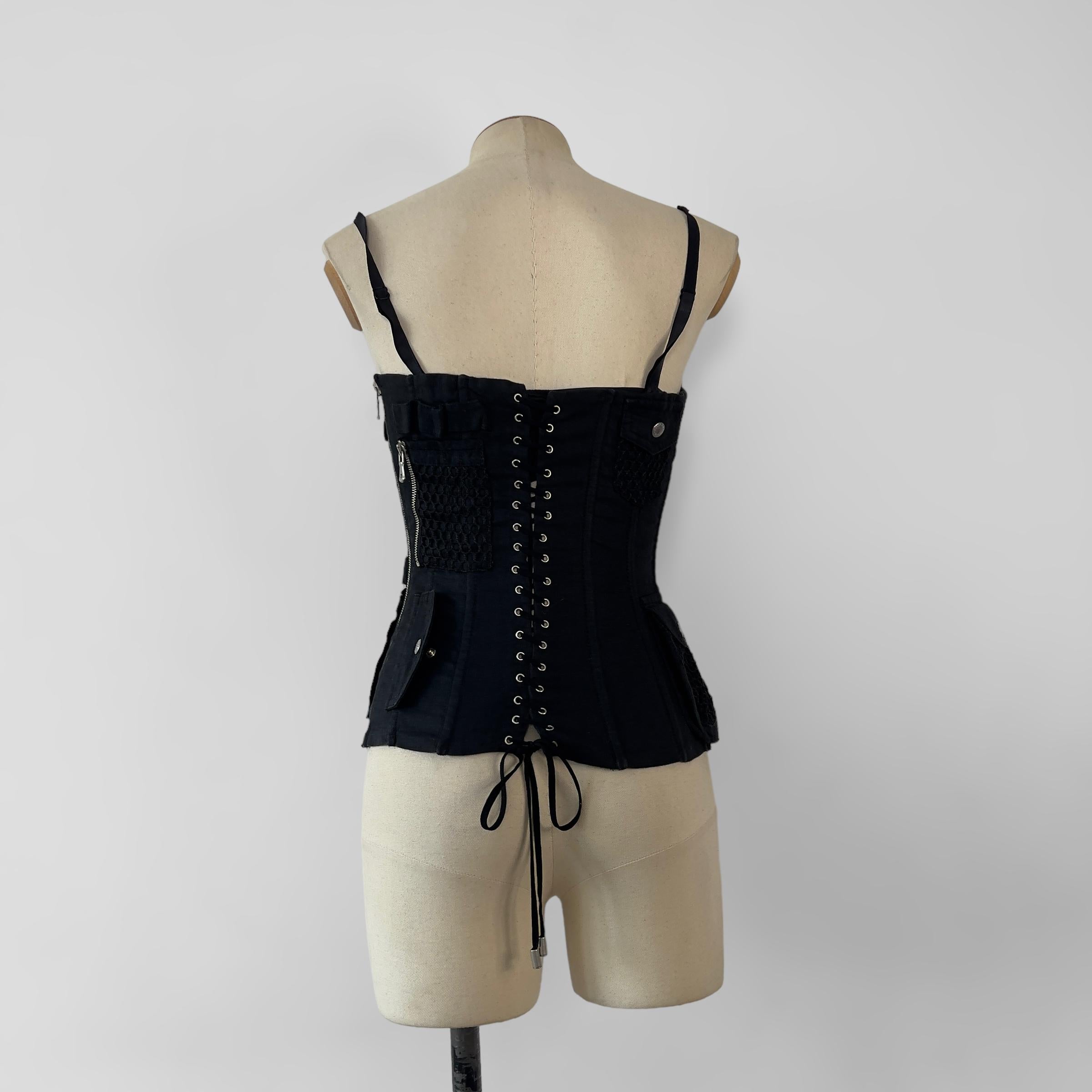 C. 2002 carco style corset by Dolce & Gabbana with build in BH.

Size: IT40, circa S
Condition: 8/10, very good preloved condition 