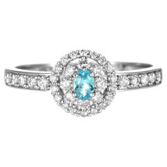 Ring aus Platin mit 0.10 Karat brasilianischem Paraiba-Turmalin und Diamanten