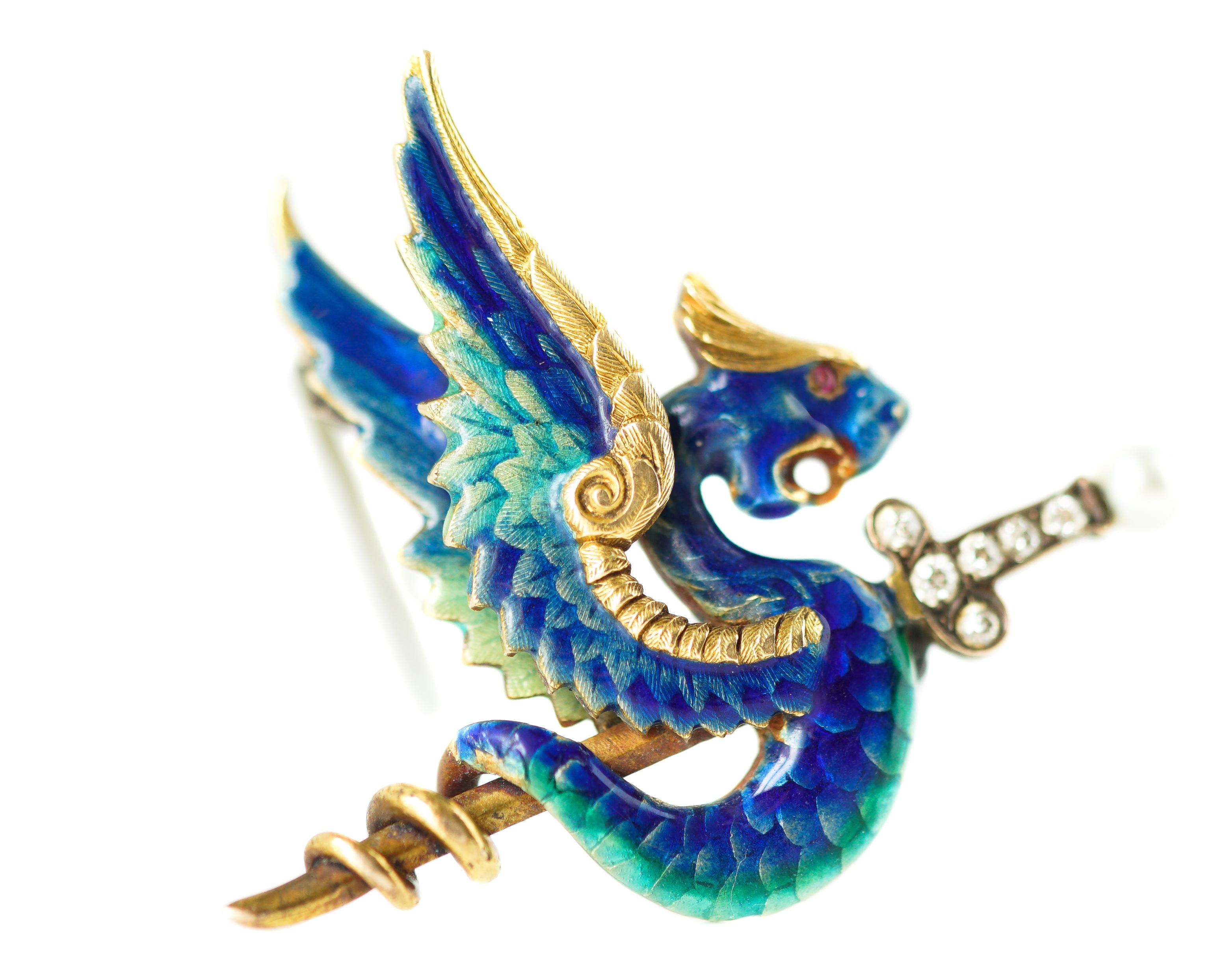 Gorgeous Enamel Dragon and Sword Pin Brooch (convertible to Pendant) crafted in 14 karat Yellow Gold, Enamel, Diamonds, Seed Pearl

Features:
2 Winged Dragon with Serpent Tail carrying a Long Sword
Stunning Mediterranean Blue, Teal and Green Enamel