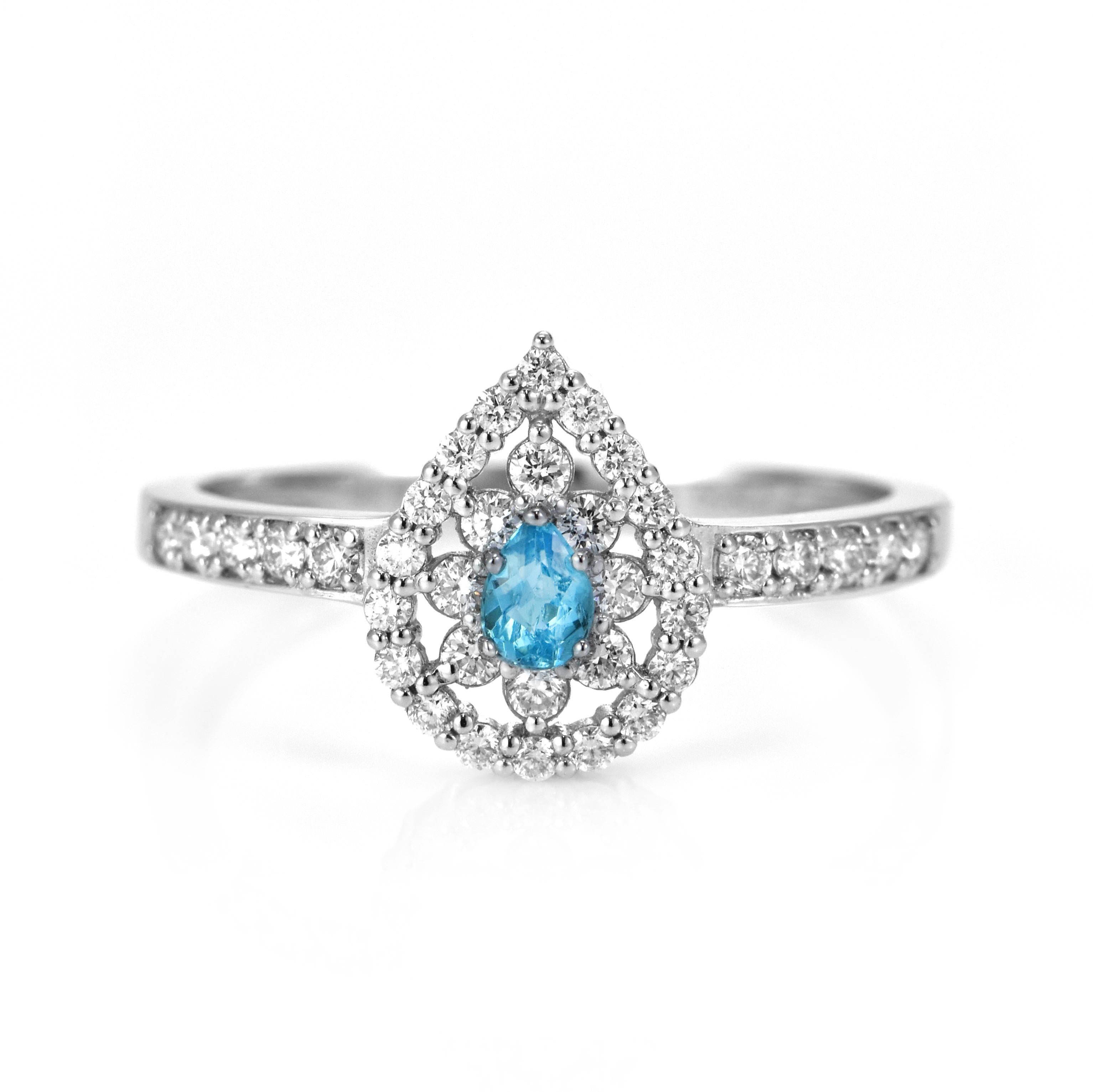 A beautiful ring featuring 0.10 Carats Natural Paraiba Tourmaline and 0.30 Carats of Diamond Accents made in Platinum. Paraiba Tourmalines were only discovered 30 years ago in the Brazilian state of the same name- Paraiba. Since then they have