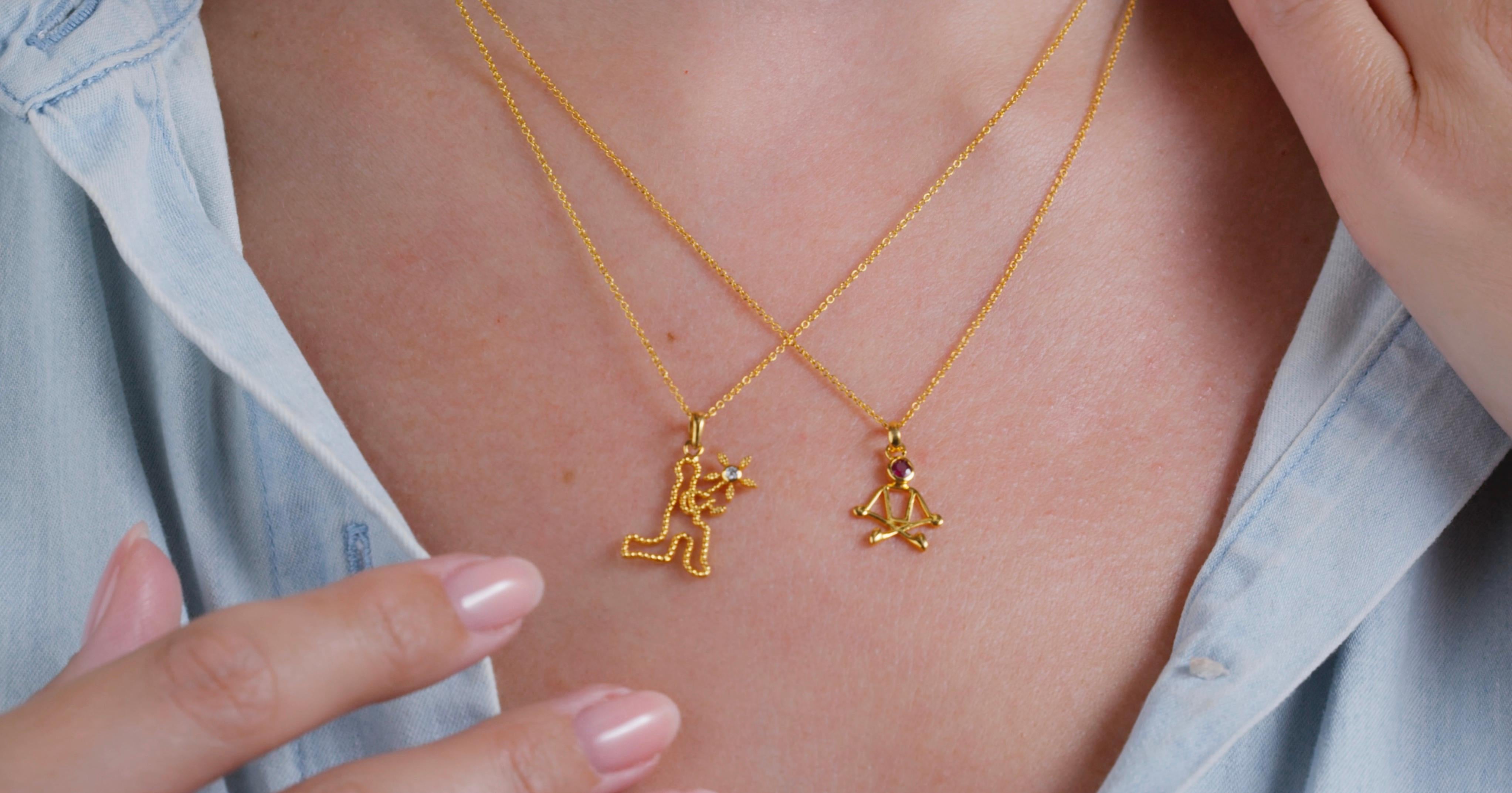 Women's or Men's 0.10 Carat Ruby 18 Karat Yellow Gold Stick Figure Meditating Necklace For Sale