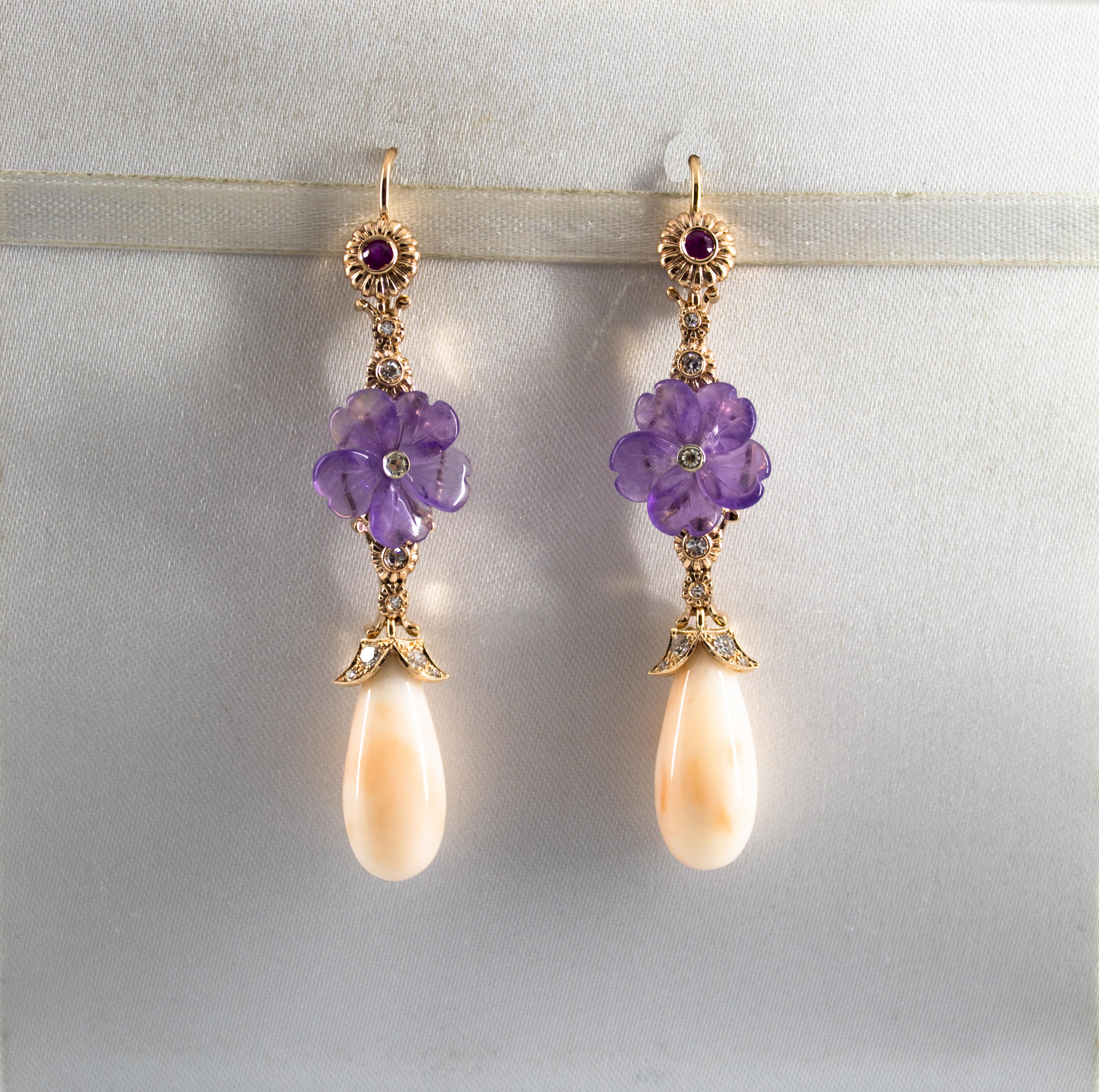 These Stud Earrings are made of 14K Yellow Gold.
These Earrings have 0.35 Carats of White Diamonds.
These Earrings have 0.10 Carats of Rubies.
These Earrings have also Pink Coral and Amethyst.
All our Earrings have pins for pierced ears but we can