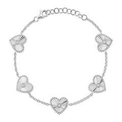 Bracciale a cuore scanalato con diamanti rotondi taglio brillante da 0,10 ct.