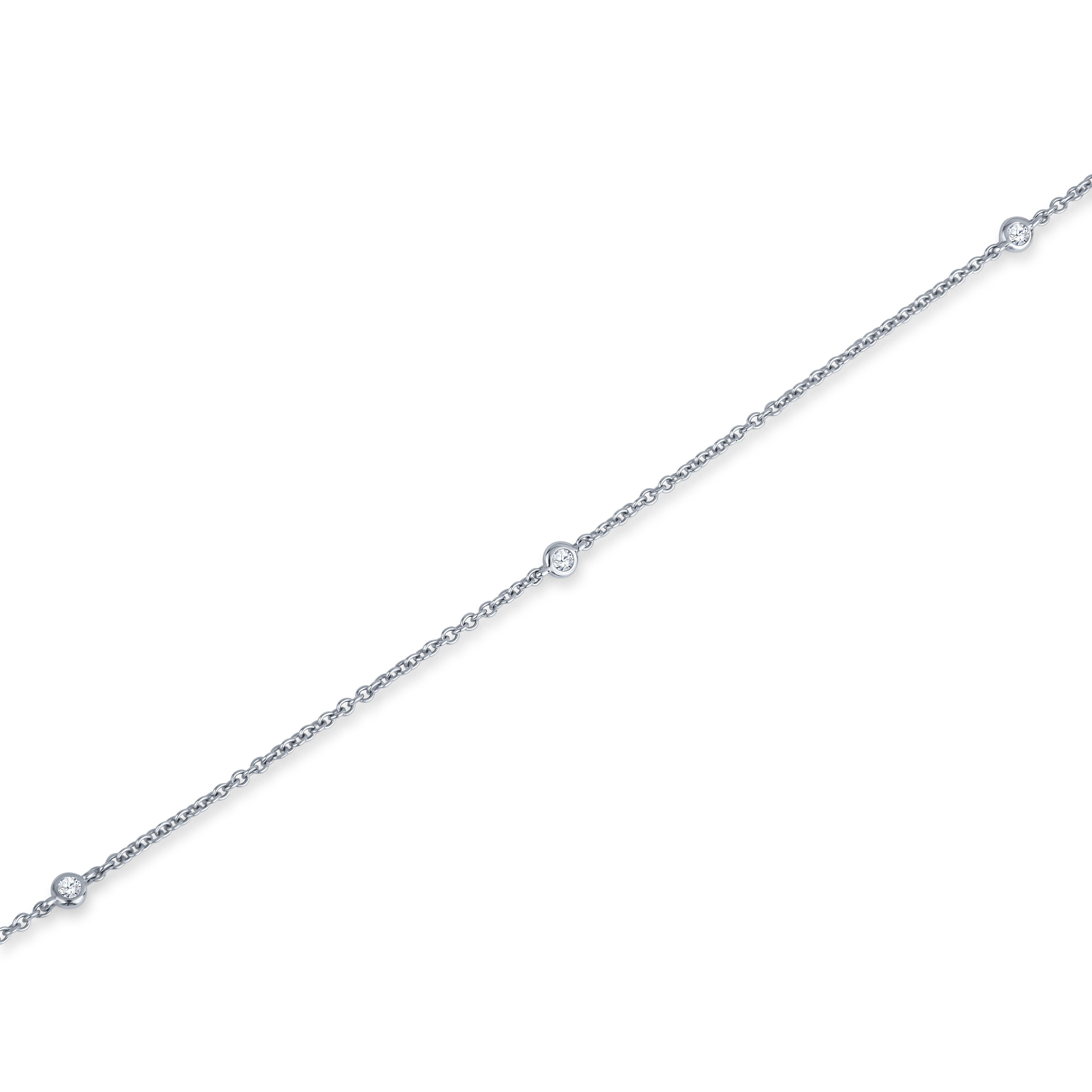 This station necklace is part of our Soft Glamour collection. It features six round diamonds with a a 0.10ctw. The chain is made is 18kt white gold and is 16.5 inches long. It is the ideal necklace to add casual elegance for everyday wear.
