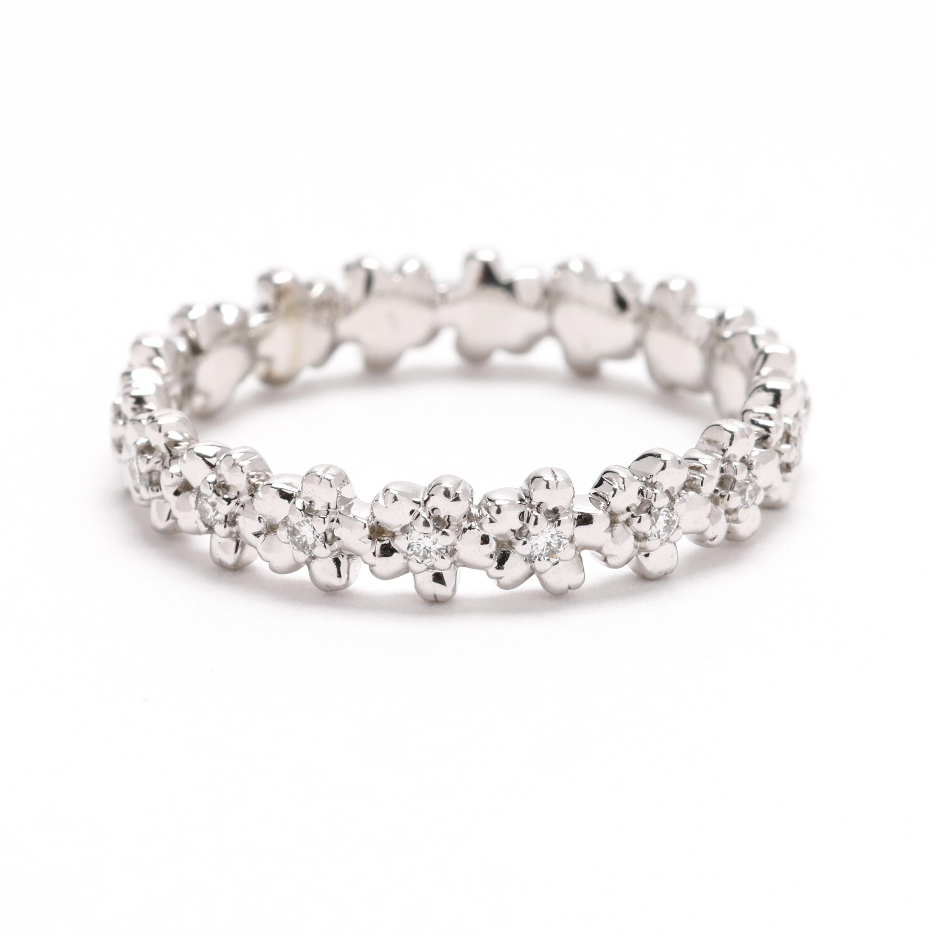 Add a touch of charm to your jewelry collection with this 0.10ctw diamond flower band ring, crafted in 14k white gold. This size 6 ring features a delicate floral design adorned with sparkling diamonds, making it a perfect choice for nature lovers