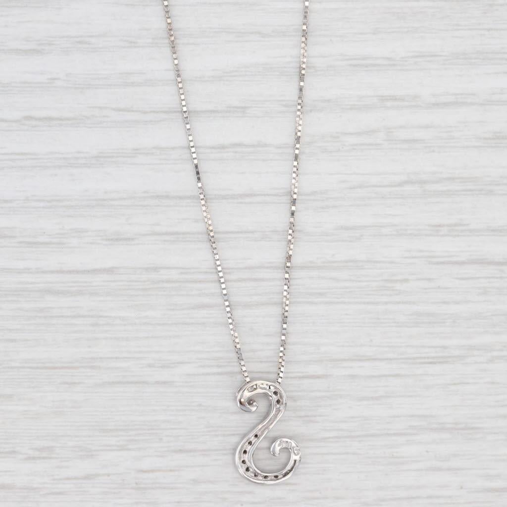 Gemstone Information:
- Natural Diamonds -
Total Carats - 0.10ctw
Cut - Round Brilliant
Color - H - K
Clarity - I1 - I2
Please note there are surface reaching inclusions.

Metal: 14k White Gold
Weight: 4.2 Grams 
Stamps: 14k 585
Chain Style: Box