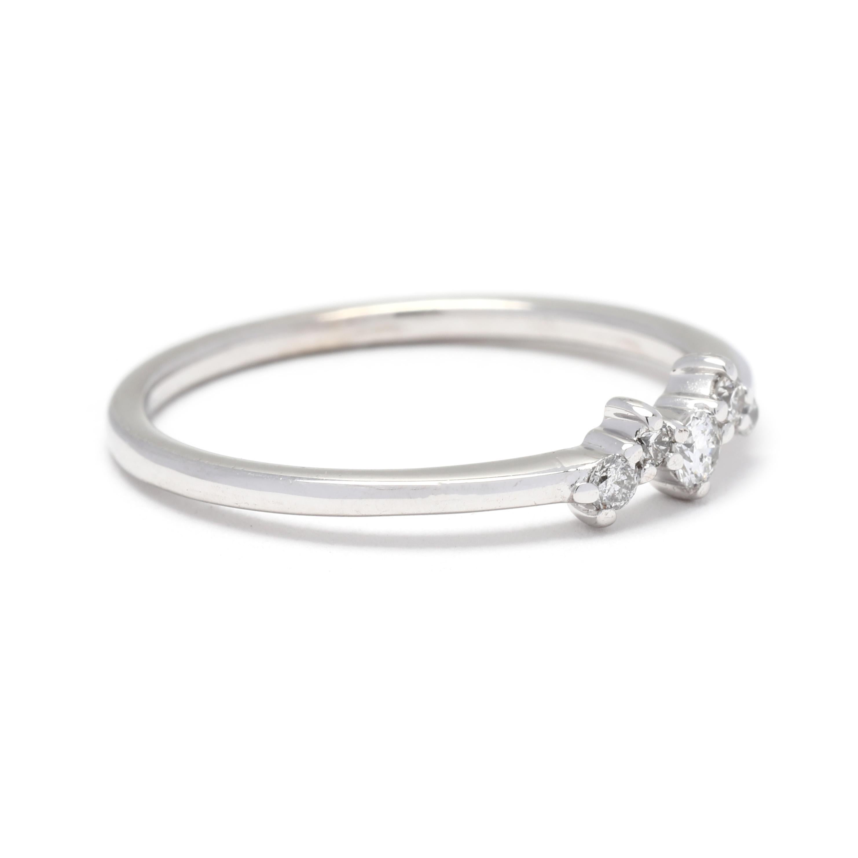 This dainty and delicate diamond band is crafted in 10K white gold and features a total weight of 0.10ctw diamonds. The scattered arrangement of diamonds gives this ring a unique and modern look. With a ring size of 6.75, it is the perfect fit for a