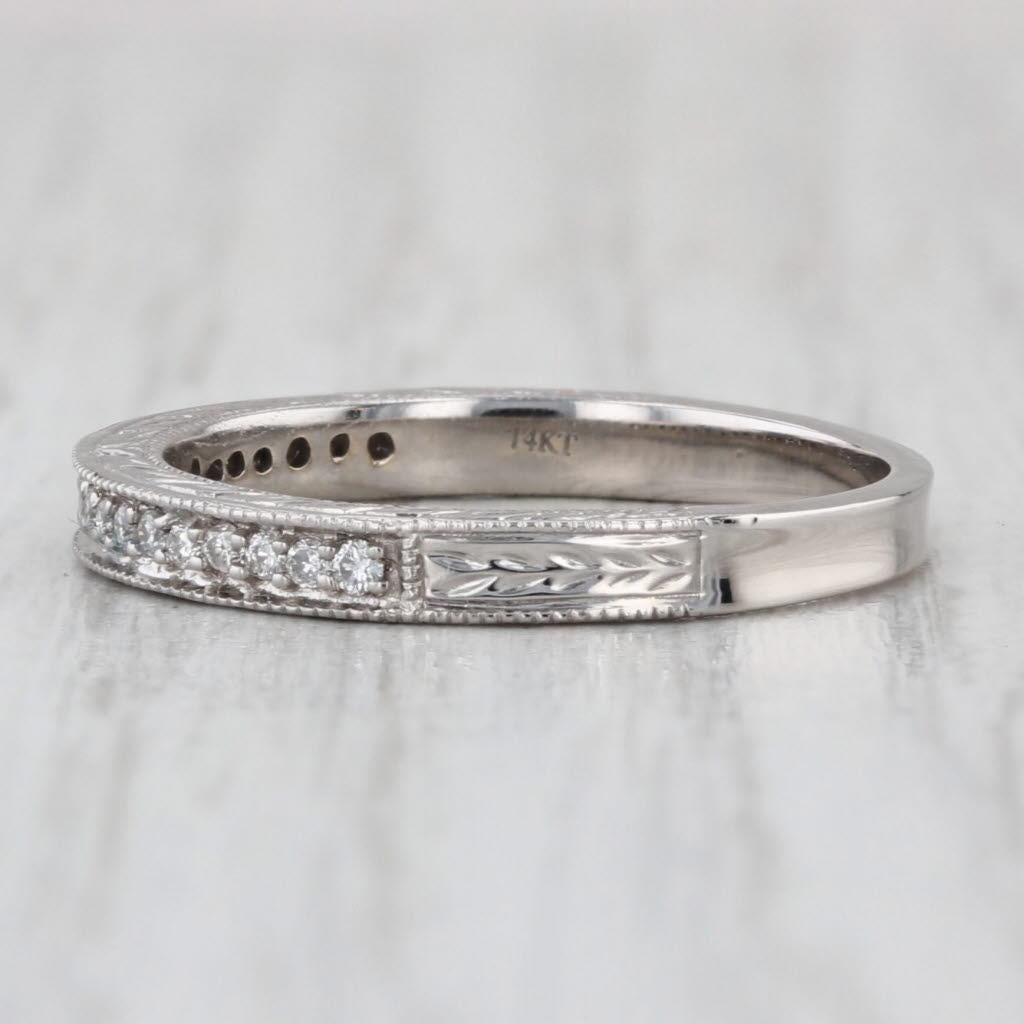 Gemstone Information:
- Natural Diamonds -
Total Carats - 0.10ctw
Cut - Round Brilliant
Color - H - I
Clarity - SI1 - I1

Metal: 14k White Gold
Weight: 2.6 Grams 
Stamps: 14kt
Face Height: 2.6 mm 
Rise Above Finger: 2.3 mm
Band / Shank Width: 2.3