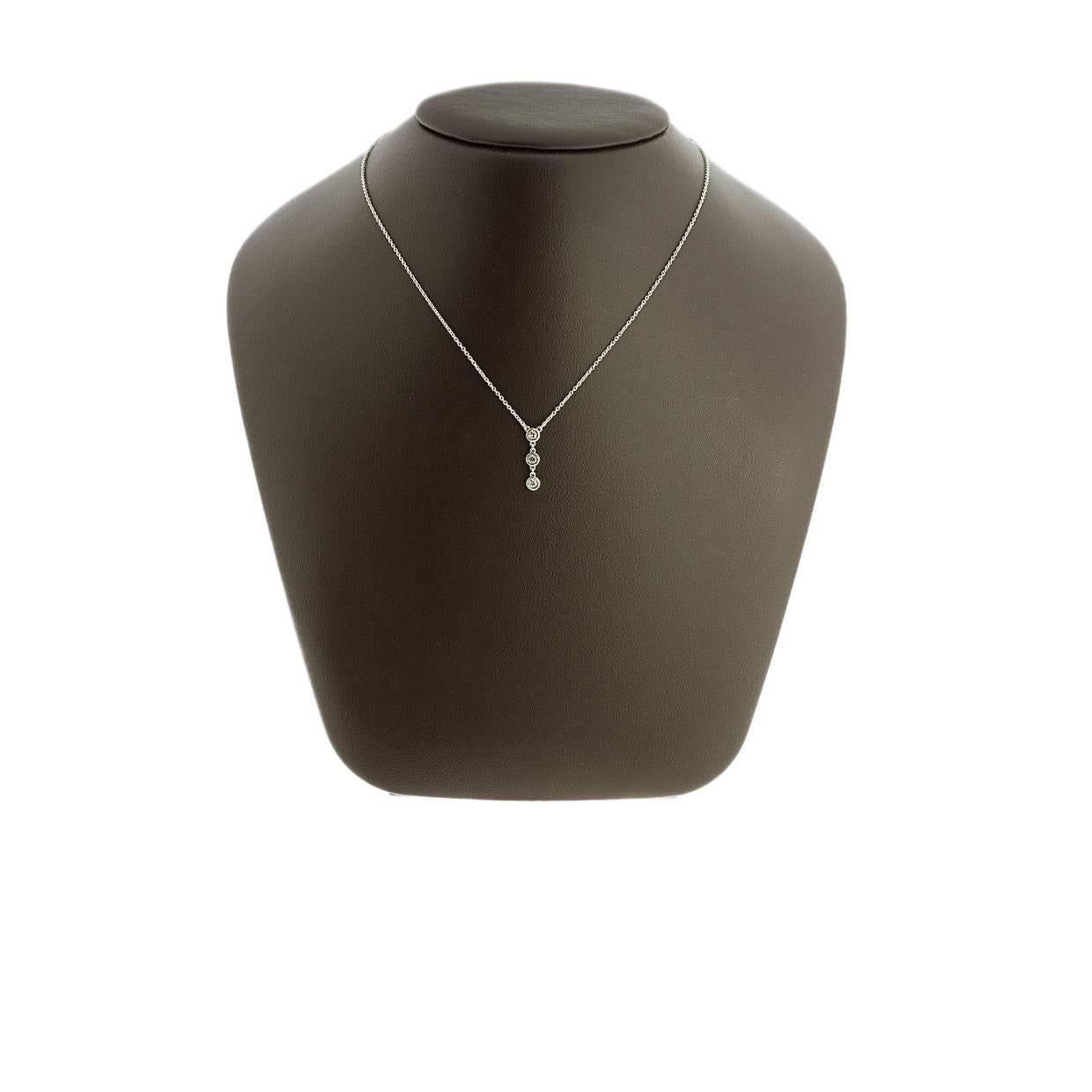 Make this beautiful Tiffany & Co. Elsa Peretti Diamond by the Yard drop pendant necklace yours today! It is comprised of sterling silver and sparkles with 0.10 carats of round diamonds. MSRP $1,175!

Tiffany & Co. Sterling Silver Necklace
Diamond by