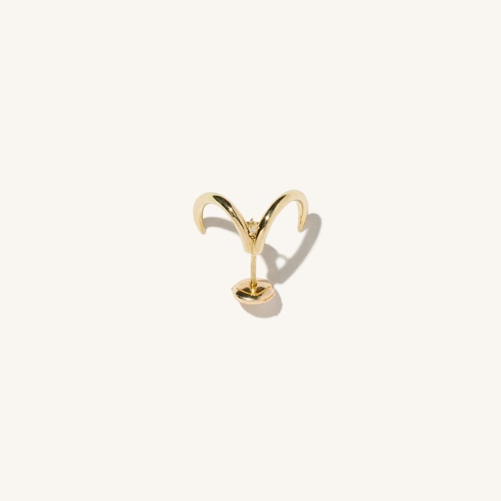Zodiac inspired items are special items that have long been said to be auspicious. MILAMORE's zodiac motif earrings take form in 18 karat yellow gold accented with a single, sparkling, marquise cut diamond and finished in an abstract shape that