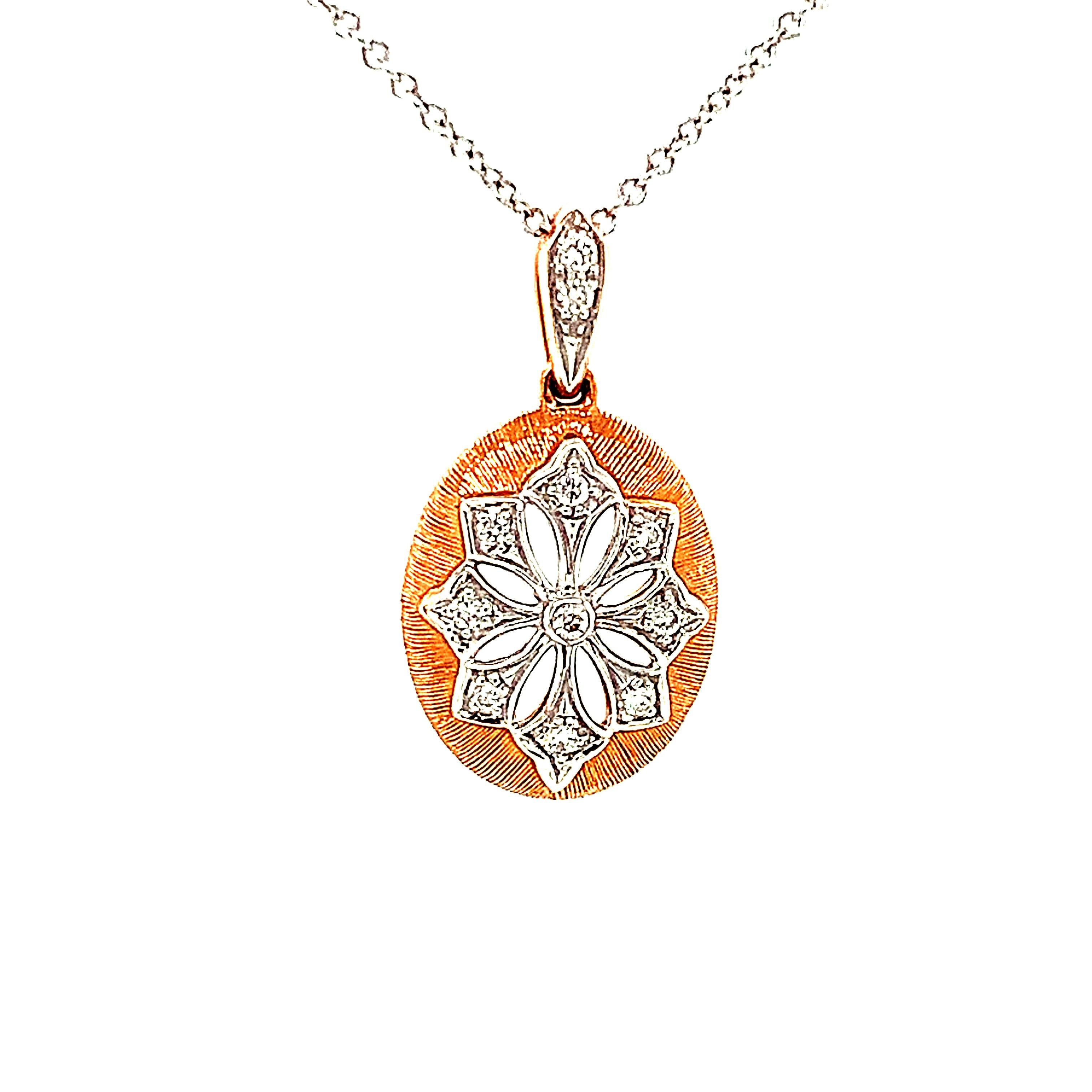 This necklace features a delicate Florentine-inspired starburst design that has been pave-set with sparkling diamonds! The 14k white gold starburst shows off beautifully intricate gold work and sits on a domed oval background of brush-finished 14k