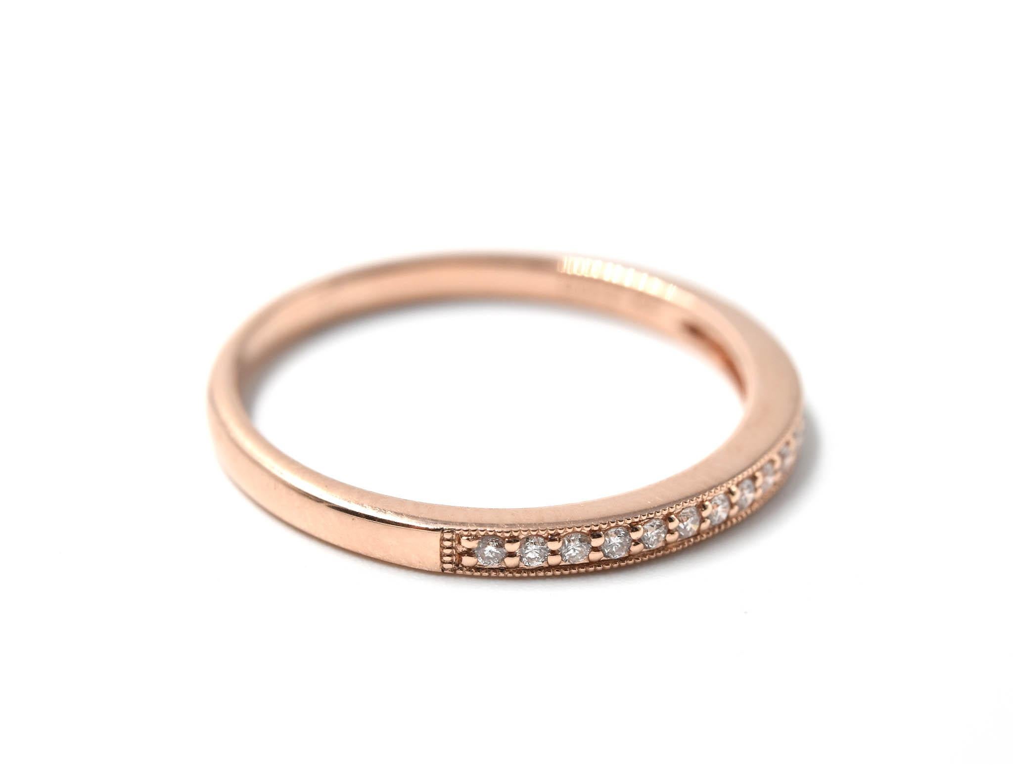 Designer: custom design
Material: 14k rose gold
Diamonds: 18 round brilliant cut diamonds = 0.12 carat total weight
Dimensions: band is 2.00mm wide
Ring size: 7 1/2 (please allow two additional shipping days for sizing requests)
Weight: 1.20 grams
