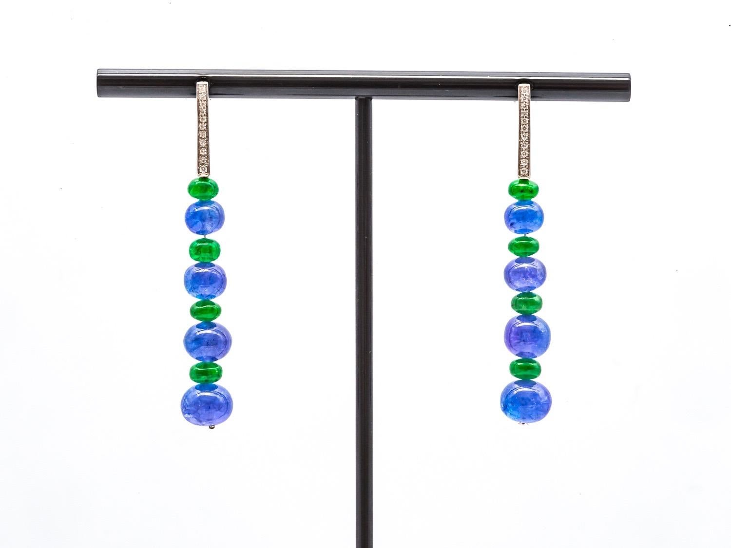 Introducing our exquisite 0.12 Carat Diamond Earrings adorned with captivating Tanzanite and Tsavorite beads, a true embodiment of elegance and grace. Each meticulously crafted earring showcases a stunning design, allowing the precious gemstones to