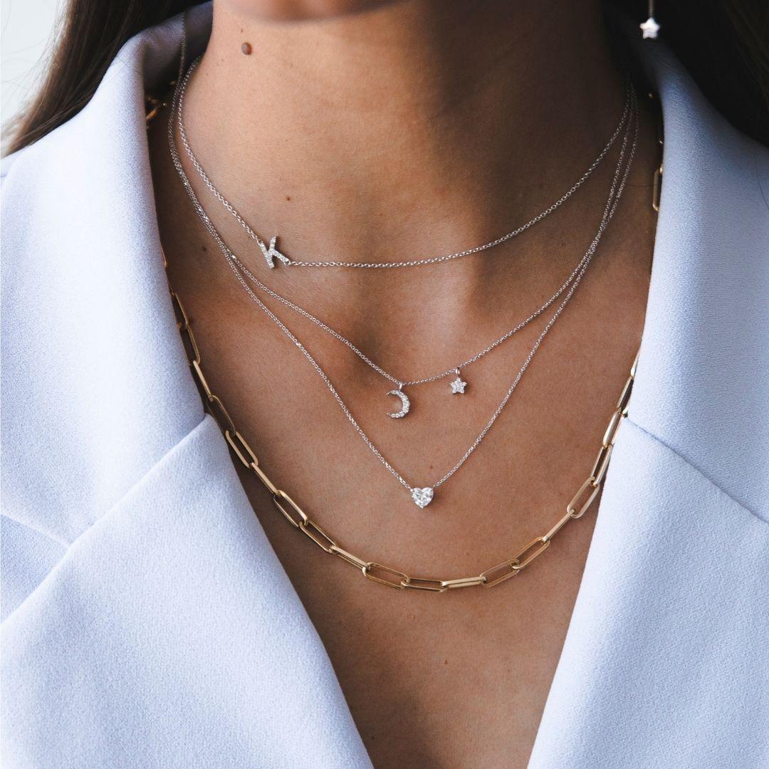 0.10 Carat Diamond Moon and Star Pendant Necklace in 14 Karat Gold Shlomit Rogel

Shine bright in this youthful yet elegant pendant necklace. Crafted from 14k white gold, the dainty chain is adorned with diamond moon and star pendants that will