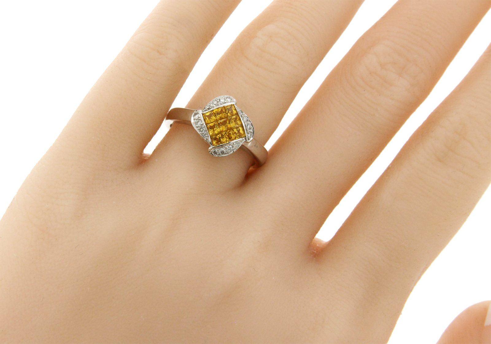 Top: 11 mm

Band Width: 2.6 mm

Metal: 18K White Gold 

Size: 6 to 8 ( Please message Us for your Size )

Hallmarks: 18K

Total Weight: 4 Grams

Stone Type: 0.12 CT G SI1 Diamonds & 1.02 Natural Yellow Sapphire

Condition: New

Estimated Retail