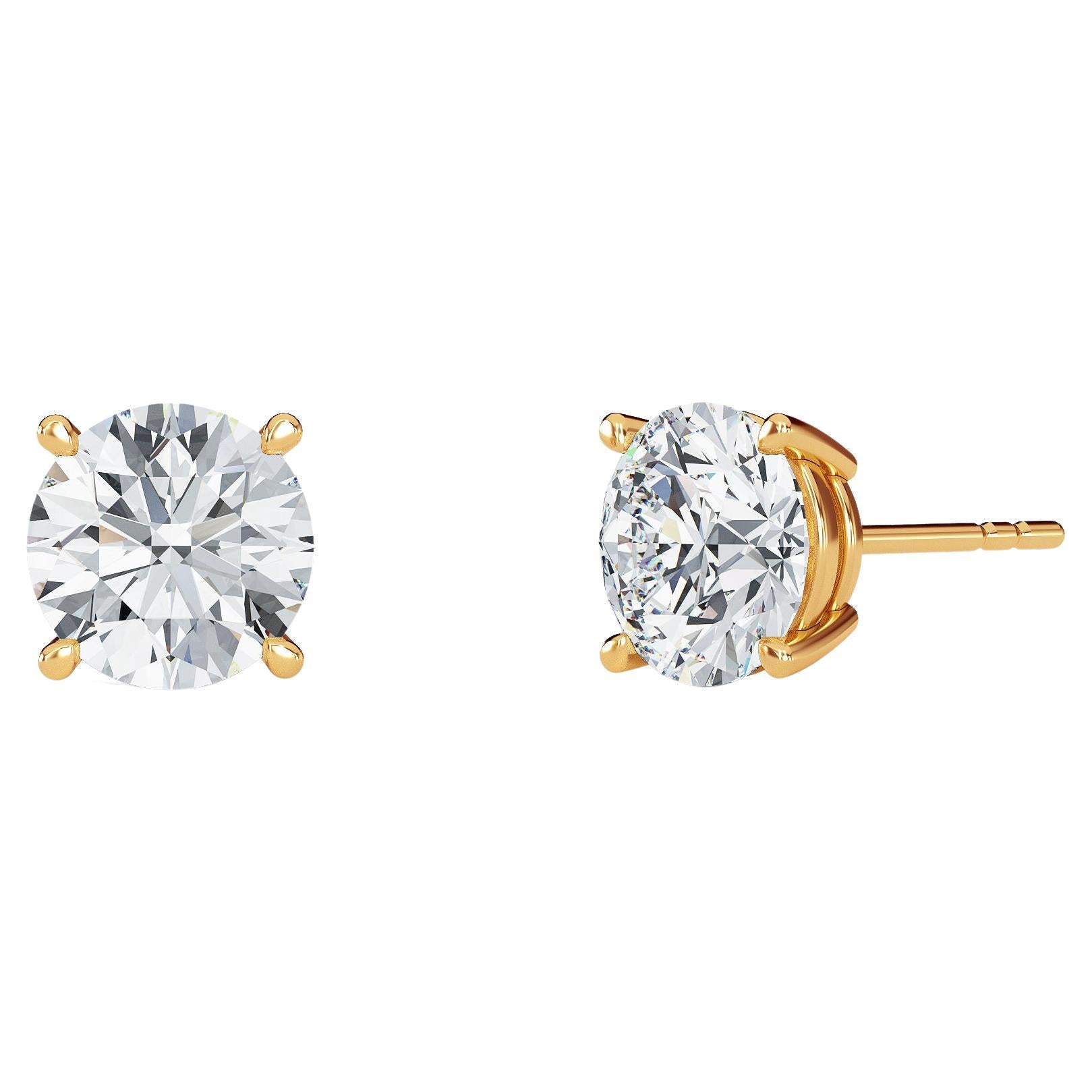 0.12 Carat TW Natural Diamond 14k Gold Four Prong Stud Earring For Sale