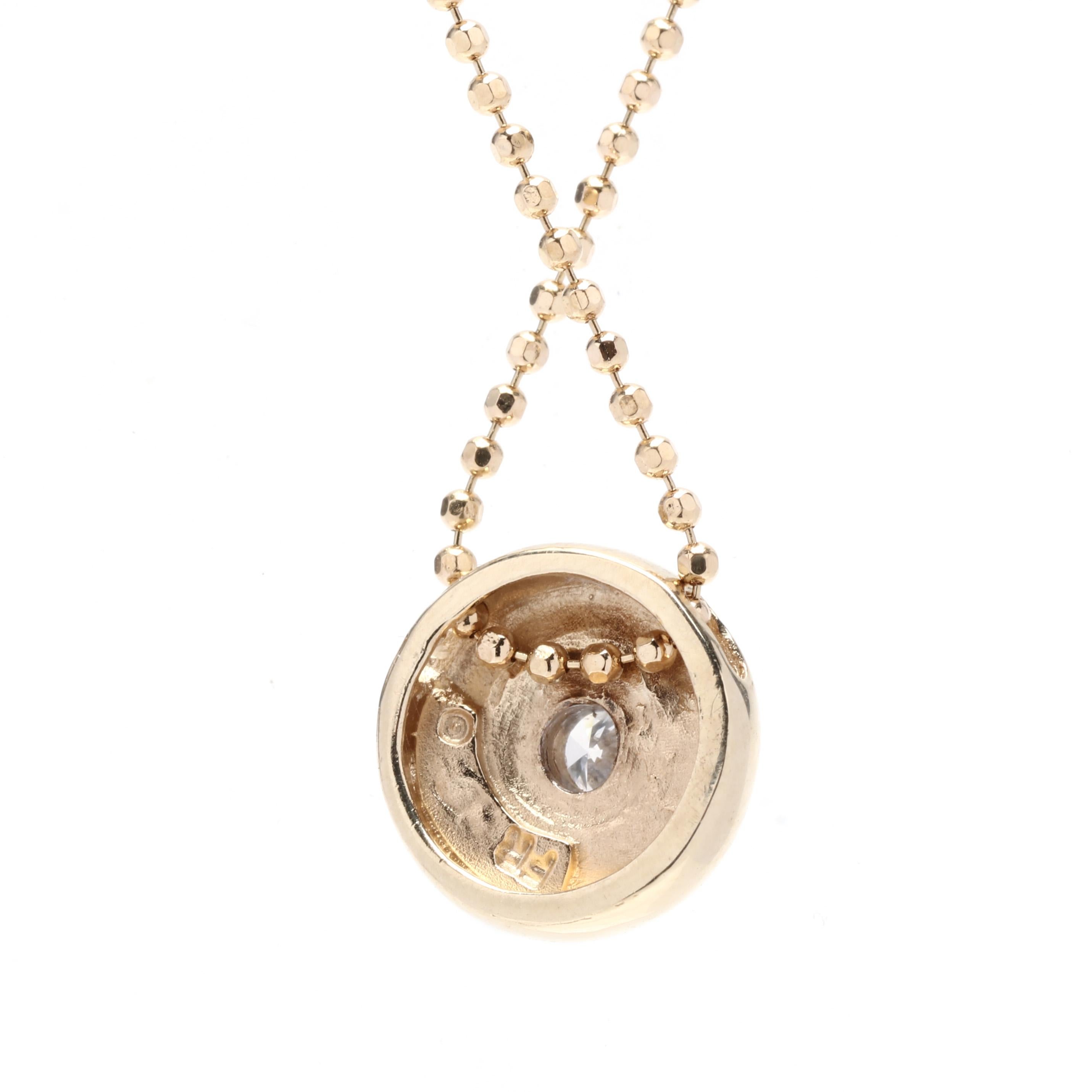 A vintage 18 and 14 karat yellow gold diamond solitaire pendant necklace. This simple pendant features a round design with a round brilliant cut diamond center stone weighing approximately .12 carat suspended from a thin beaded chain.

Stones:
-