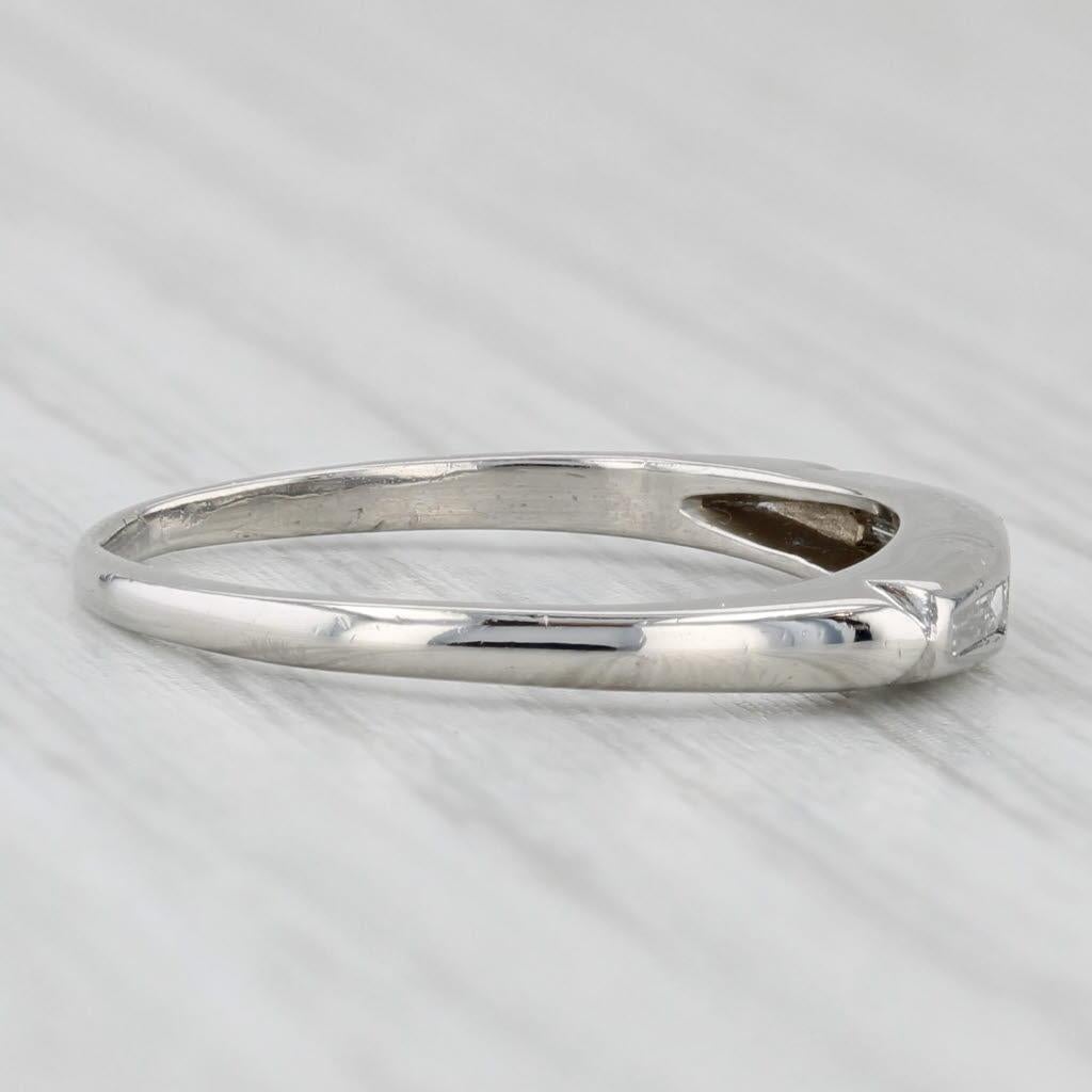 Gemstone Information:
- Natural Diamonds -
Total Carats - 0.12ctw
Cut - Baguette, Single
Color - F - G
Clarity - VS2

Metal: Platinum
Weight: 2.8 Grams 
Stamps: Plat
Face Height: 3 mm 
Rise Above Finger: 2.6 mm
Band / Shank Width: 1.4 mm

This ring