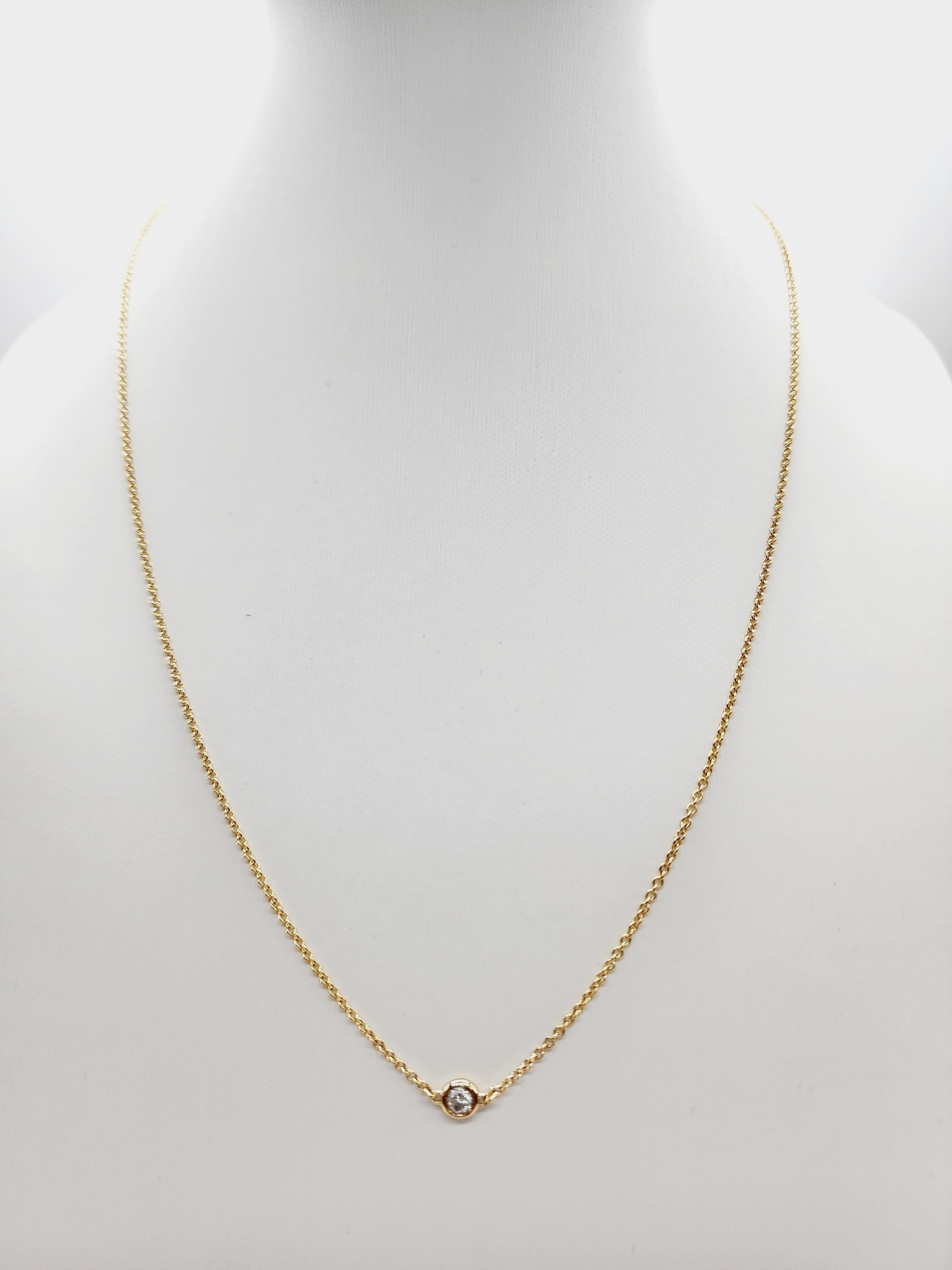 Single Station Diamond by the yard necklace set in Italian made 14K yellow gold. 
Total weight is 0.13 carats. Beautiful shiny natural diamond. 
Total length is 18 inch. Average Color/Clarity I-I