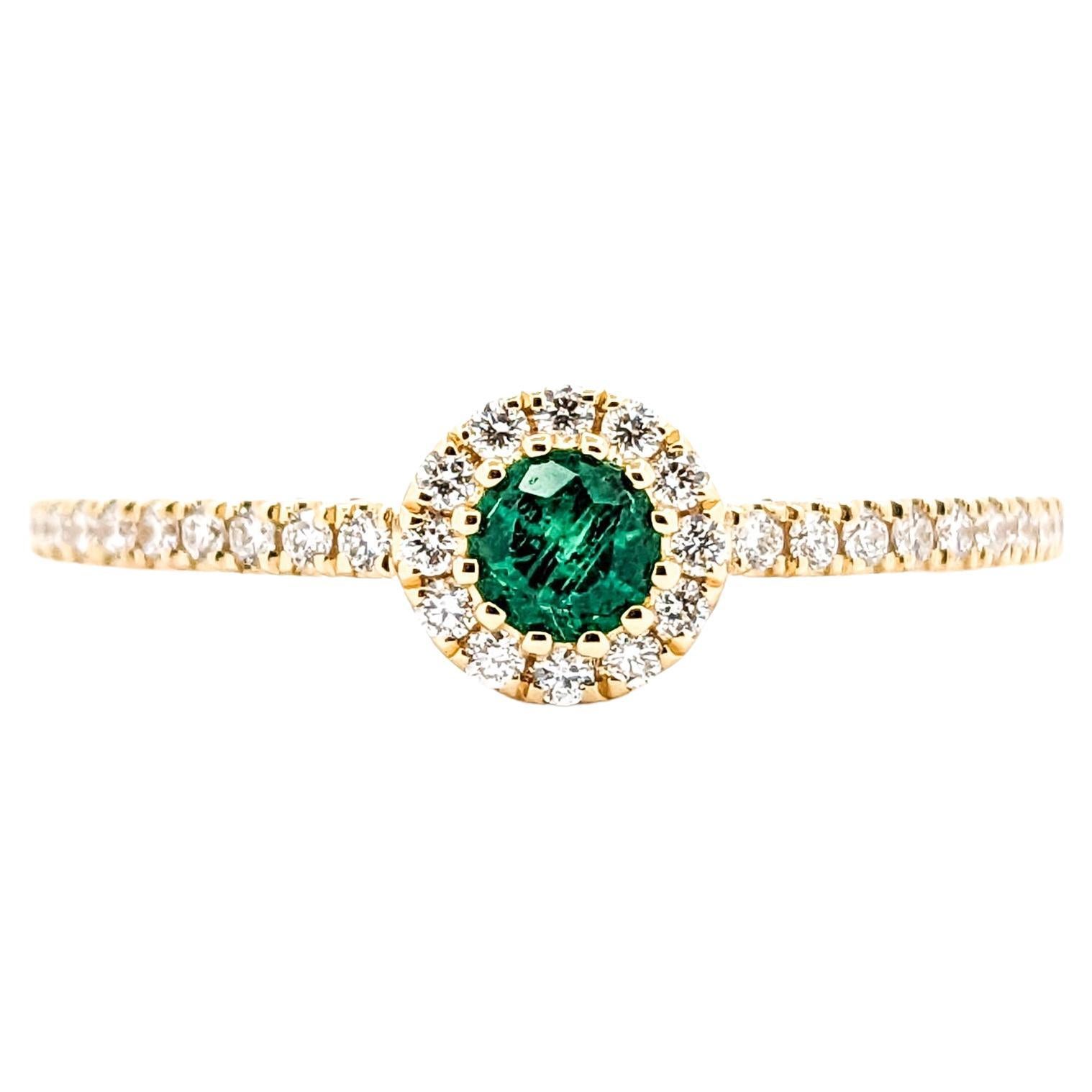 0.13ct green Emerald and Diamond Halo in 18k Yellow Gold